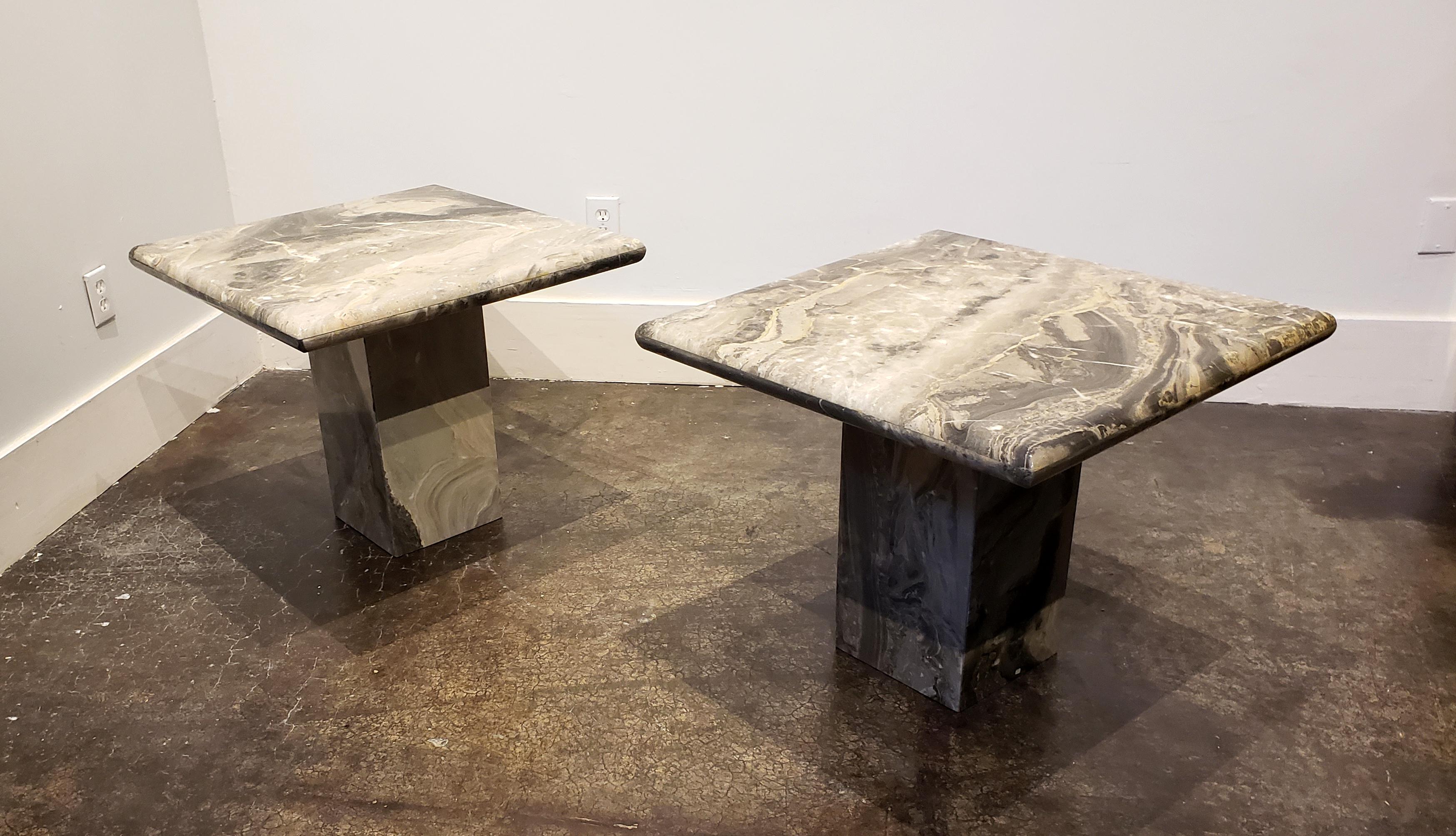1980s Italian marble side tables. Rounded-edge square tops on tall square bases. Warm Italian arabesque Orobico marble in sweeping patterns of black, grey, tan and white. Very good vintage condition with age appropriate wear. Matching coffee table