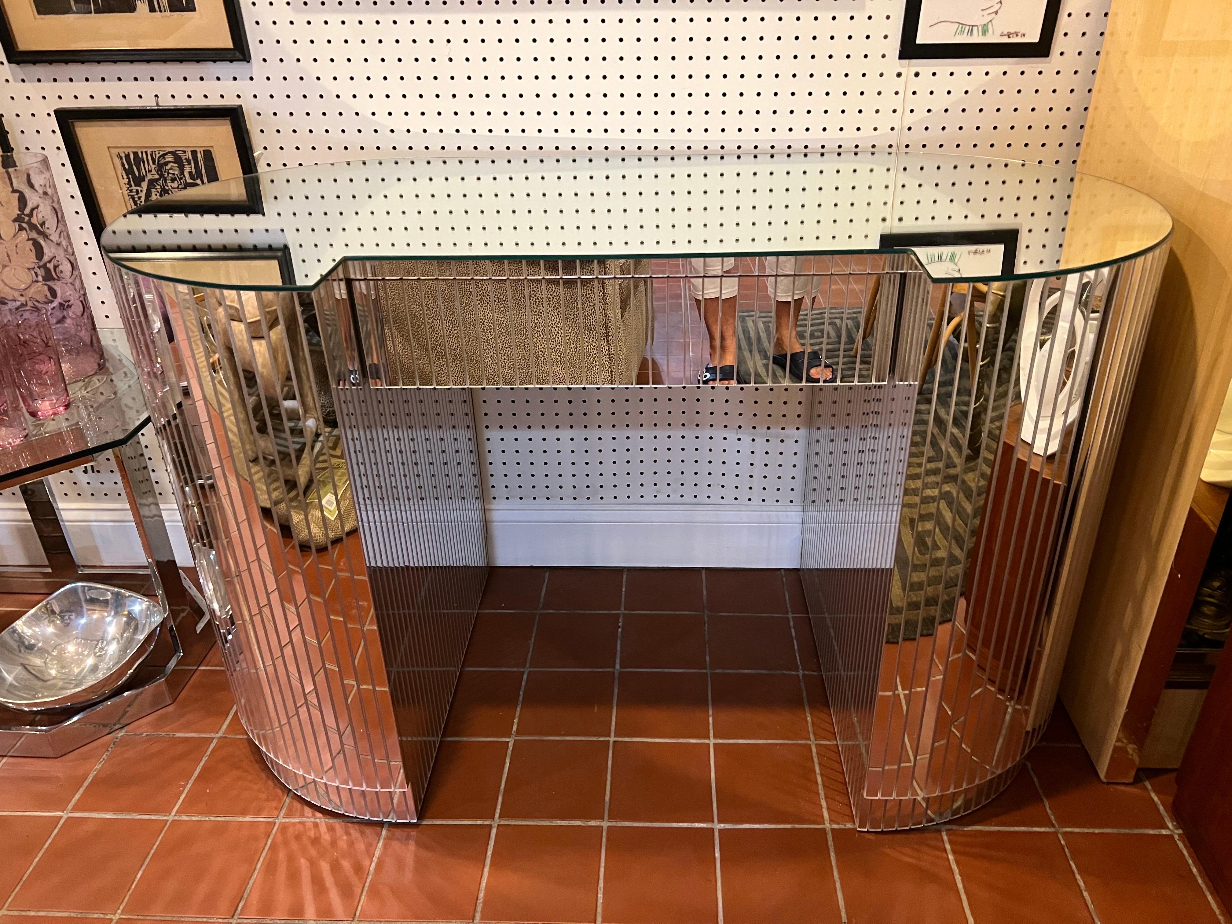1980’s mirrored Disco ball desk or vanity. Fabulous Post Modern style Kidney shape with sliced mirror design. One single drawer in the middle for storage. Use as a desk or as a vanity. it may have had a mirror attached to the back side. Marks/cracks