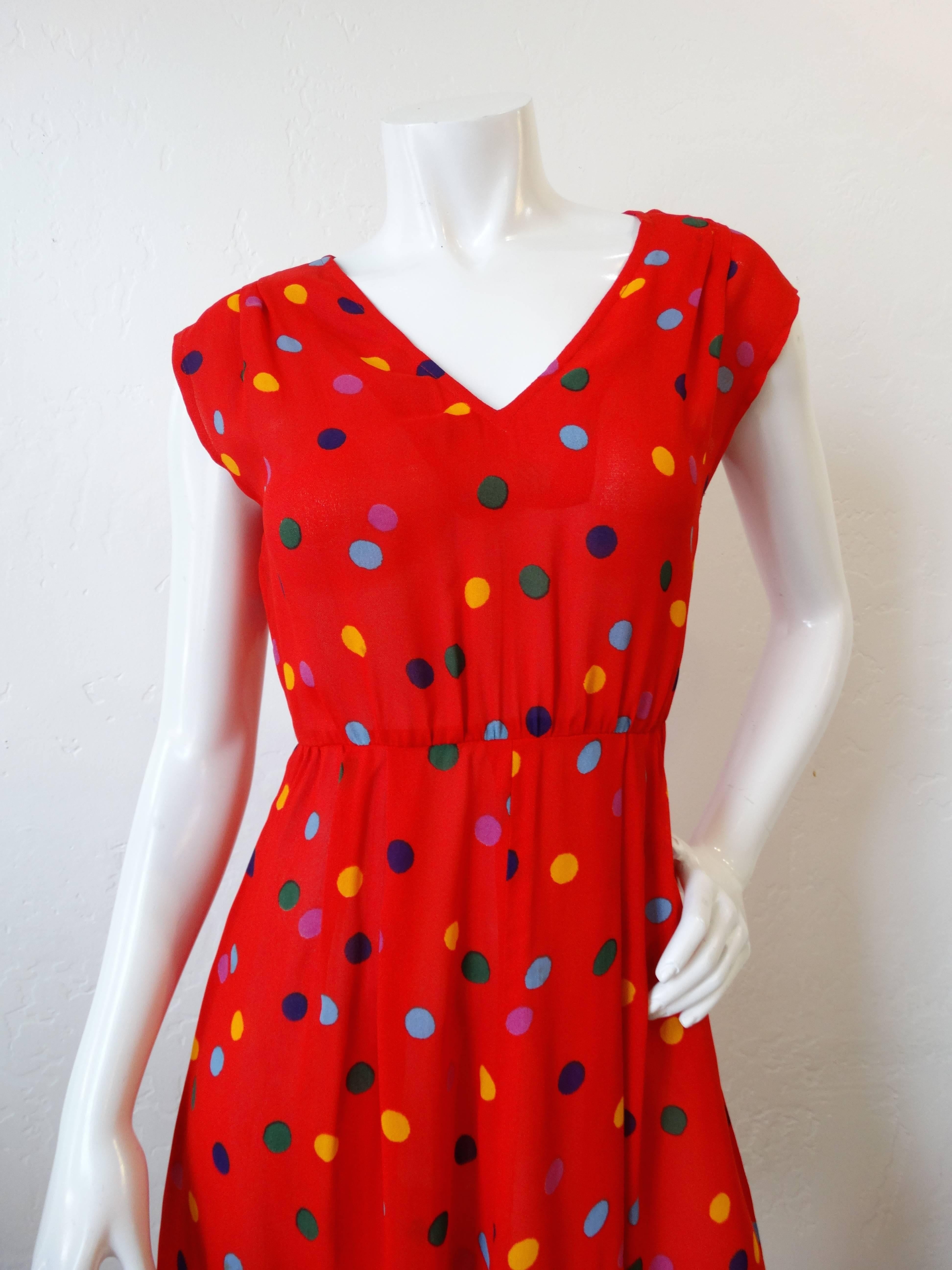 The most lovely 1980s Miss O by Oscar De La Renta polka dot dress! Bright red solid fabric covered in a rainbow of dots! Fitted bust with a v neckline and capped sleeves! This dress best fits a petite frame, XS. Zips up the back. 


Bust: 28 in