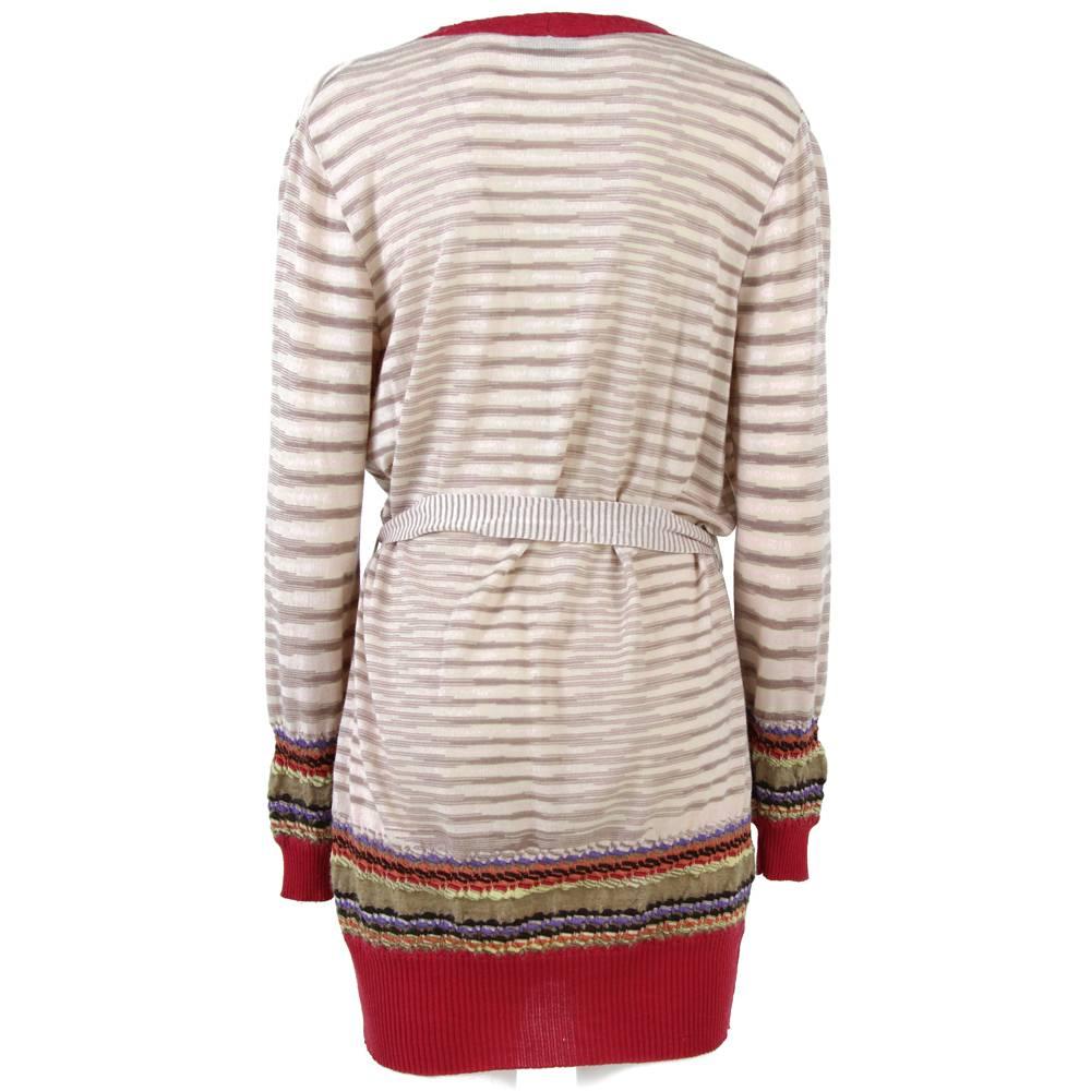 Chic and warm long Missoni cardigan in mixed wool and nylon with removable and adjustable waist belt. Mother-of-pearl buttons. Dates back to the Eighties and is in good conditions.

Measurements:
Height: 87 cm
Sleeve length: 67 cm
Chest: 51 cm
