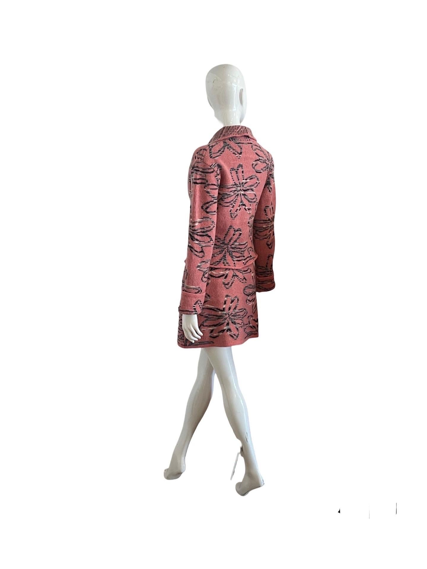 Very cute 1980s Missoni Sport set in a thick knit wool of watermelon pink with contrasting grey and white large flowers.   The jacket is closed with a single large button and there are fold over cuffs.  It is unlined and can be worn as a