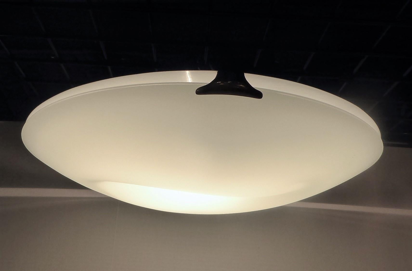 1980s frosted blown glass sculptural flush mount ceiling light with a Yin Yang form in the glass and brass side connectors. Halogen bulb light source.
Measurements: 20 inches diameter x 6 inches deep from ceiling.