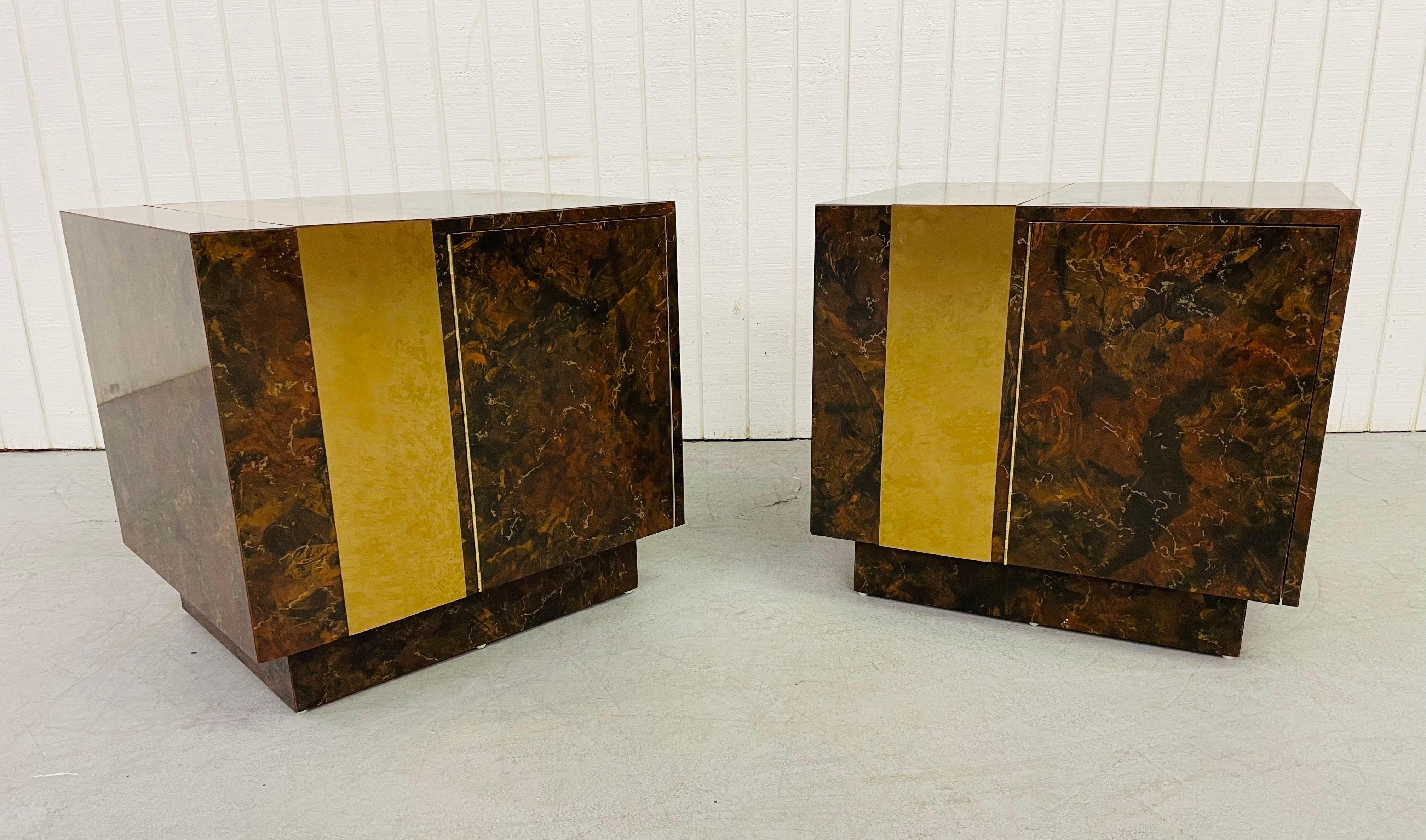 This listing is for a pair of 1980’s Modern Cube Nightstands. Featuring a burled laminated finish, brass accent, and single door that opens up to storage space.