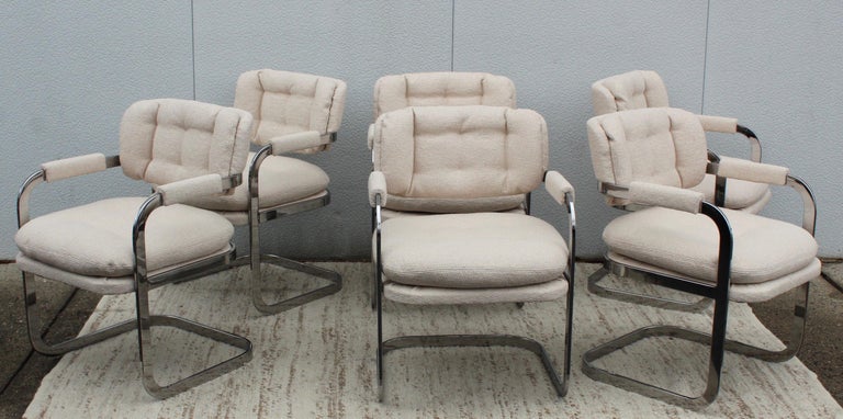 1980's Mid-Century Modern chrome and bouclé fabric dining chairs by Patrician Furniture Co. Newly re-upholstered the chrome has been lightly hand polished, the chrome shows some wear and patina due to age and use.