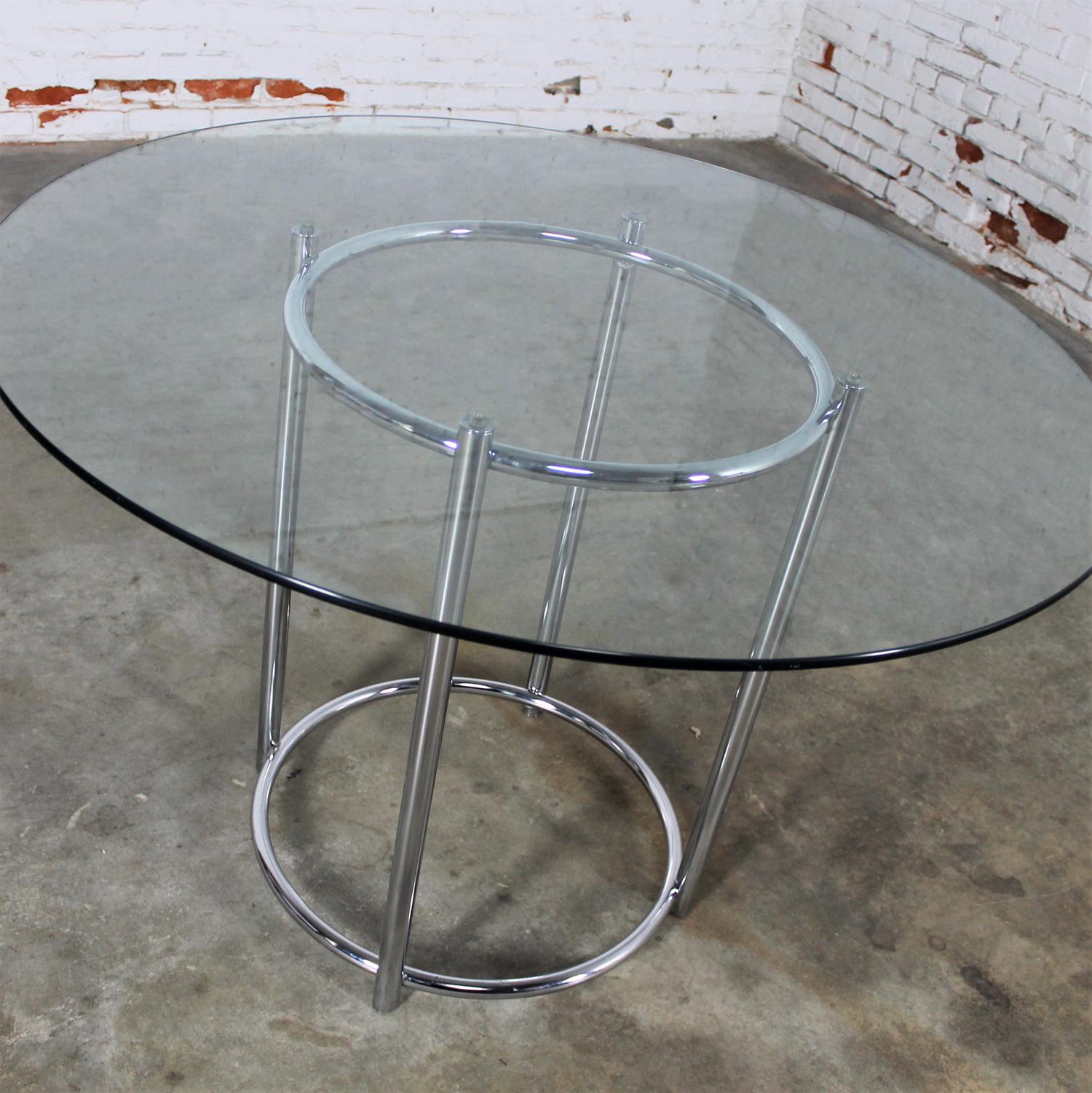 Handsome 1980’s Modern Daystrom dinette or dining table comprised of 1 inch chrome tube frame or base, 1 inch diameter rings, and a ¼ inch glass top. Beautiful condition, keeping in mind that this is vintage and not new so will have signs of use and