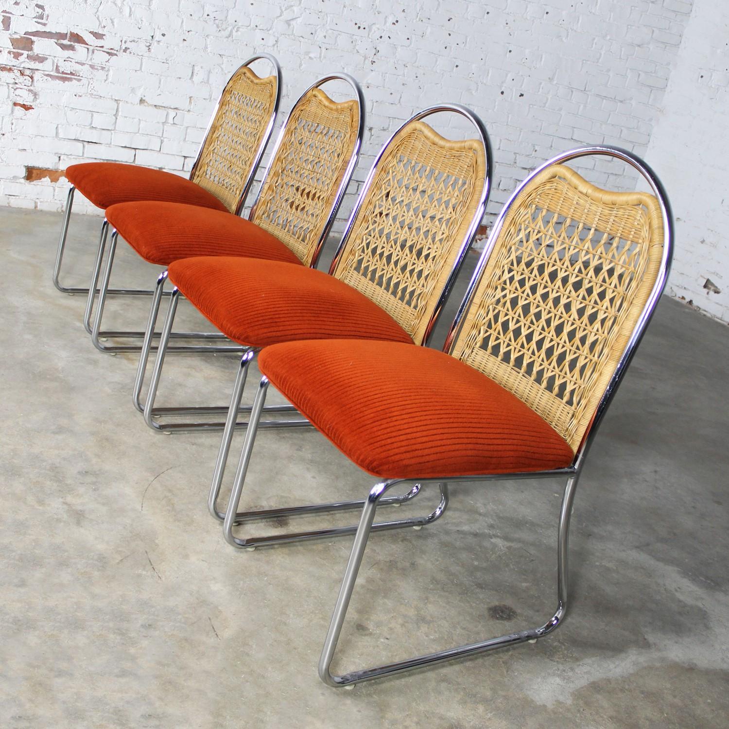 Lovely vintage Modern Daystrom dining chairs comprised of chrome frames, natural wicker seat backs, and orange fabric upholstered seats. Beautiful condition, keeping in mind that these are vintage and not new so will have signs of use and wear.