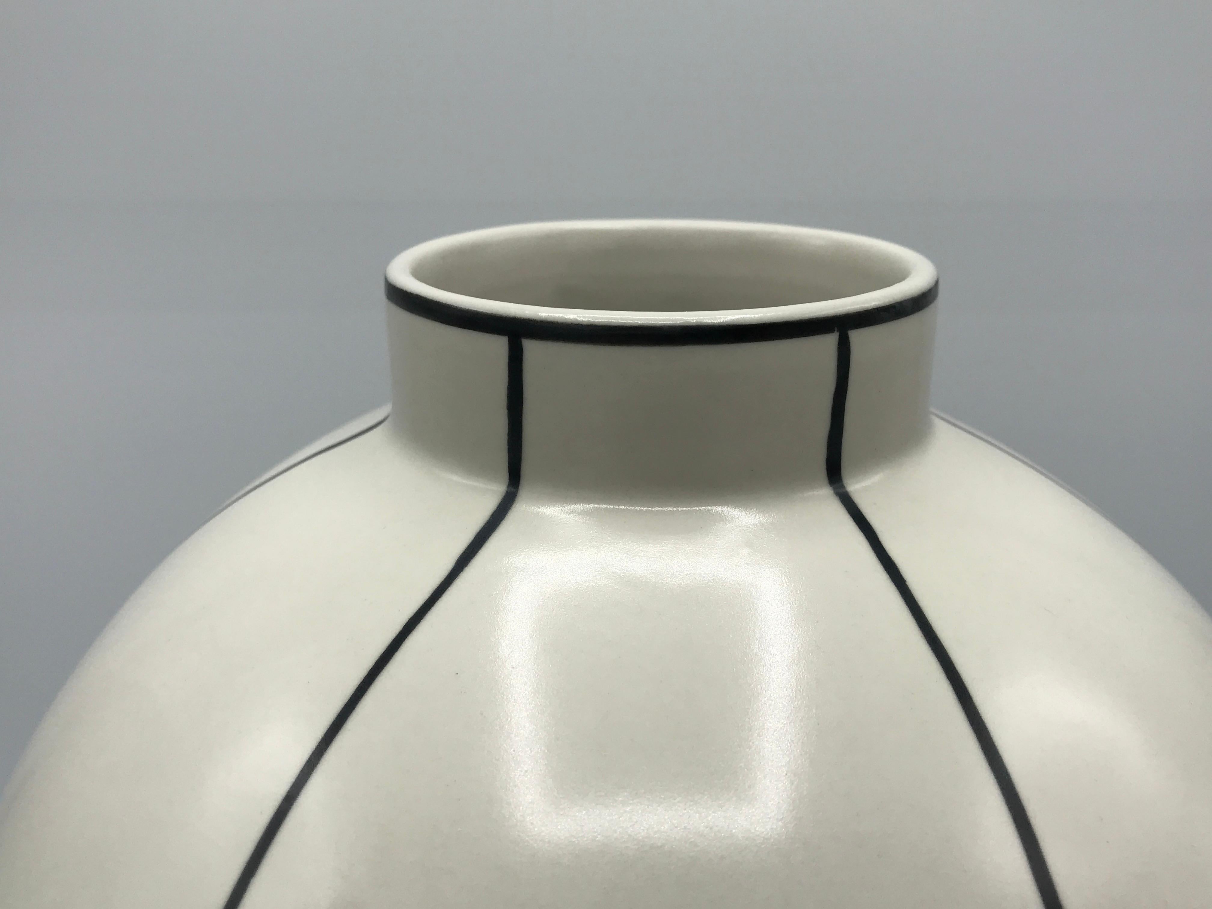 Offered is a stunning, 1980s Bitossi-style modern graphite gray and white ceramic vase. The piece has a modern minimalistic geometric motif allover, with a repetitive flipping of the half-circles. Heavy, weighs 5.5lbs.