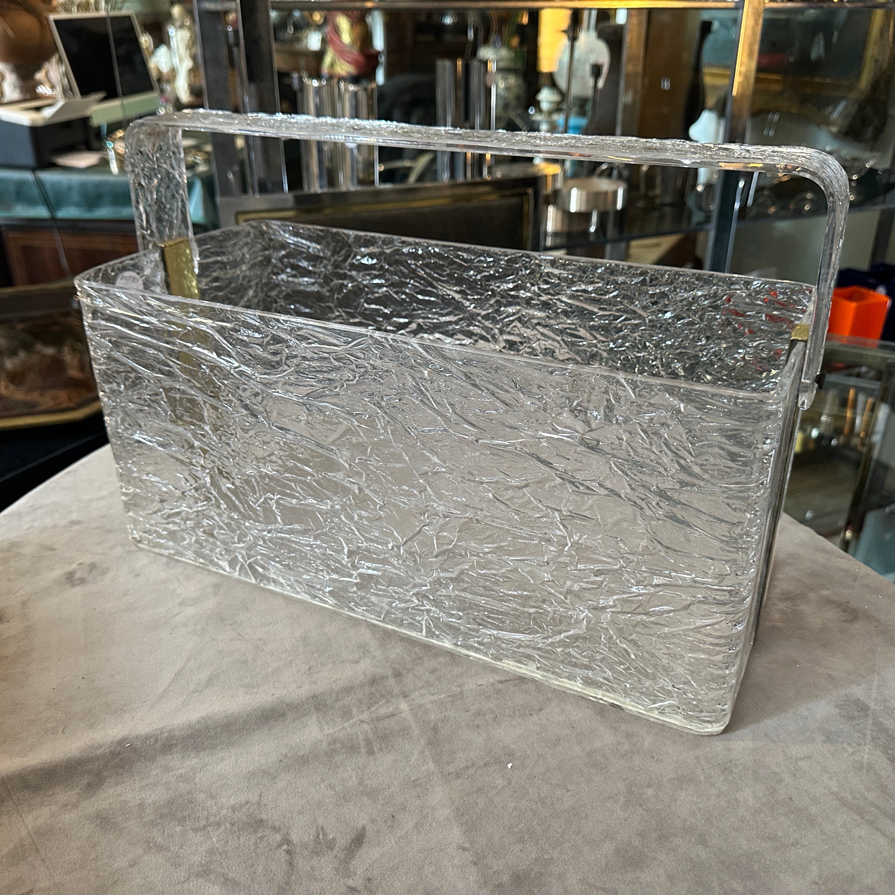 1980s Modern Iced Lucite and Brass Italian Design Magazine Rack by Cavinato
Elevate your interior with this striking 1980s Italian magazine rack, designed by Cavinato. A prime example of modern design, this piece features thick, textured 