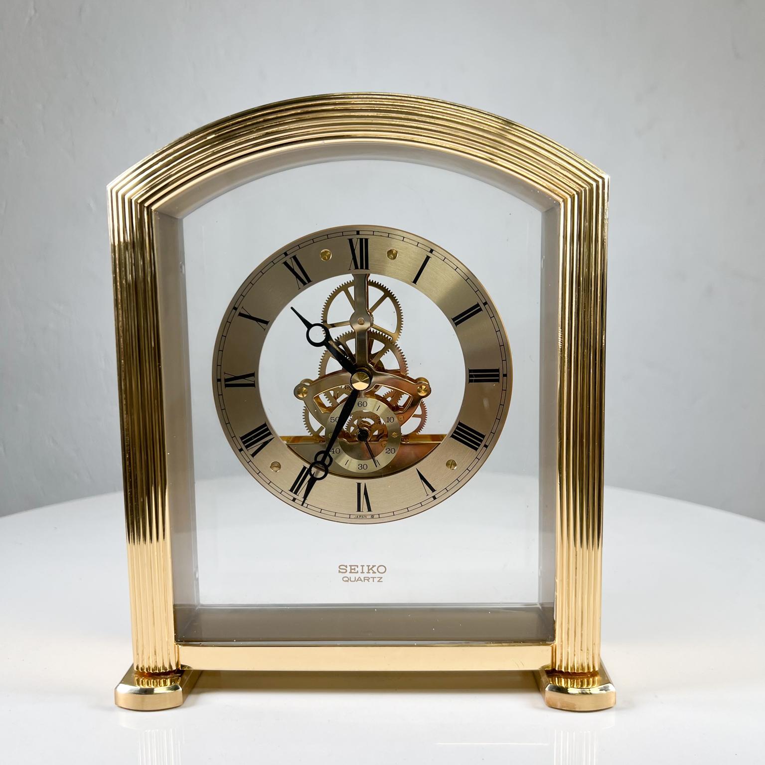 1980s Modern Seiko Skeleton Quartz desk clock in brass
Measures: 8.75 tall x 2.25 depth x 7.38 width
Preowned unrestored vintage condition
Tested and working
See images provided.

  