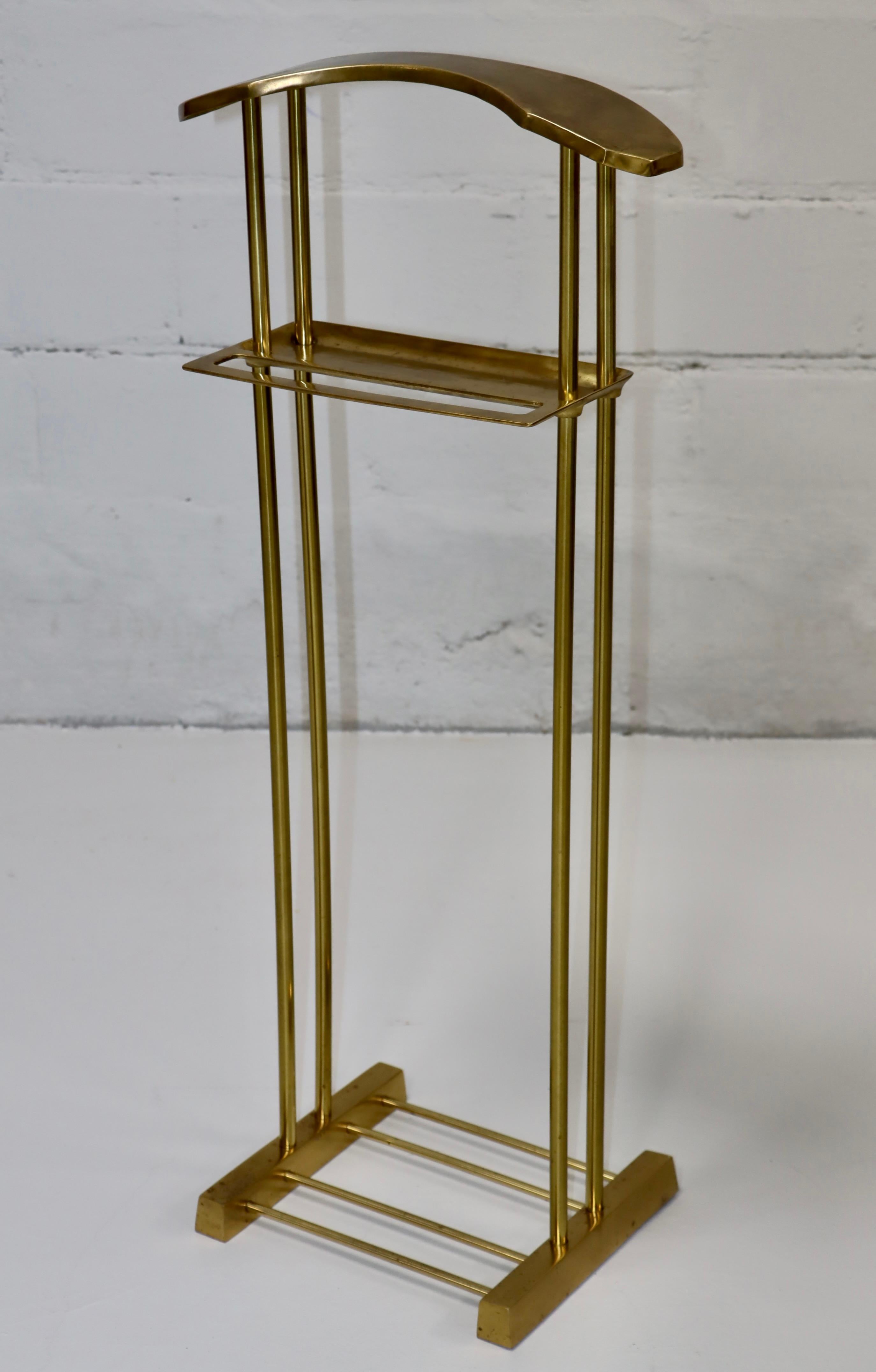 1980's modernist brass valet stand by Decorative Crafts Inc. In vintage original condition with some wear and patina to the brass.