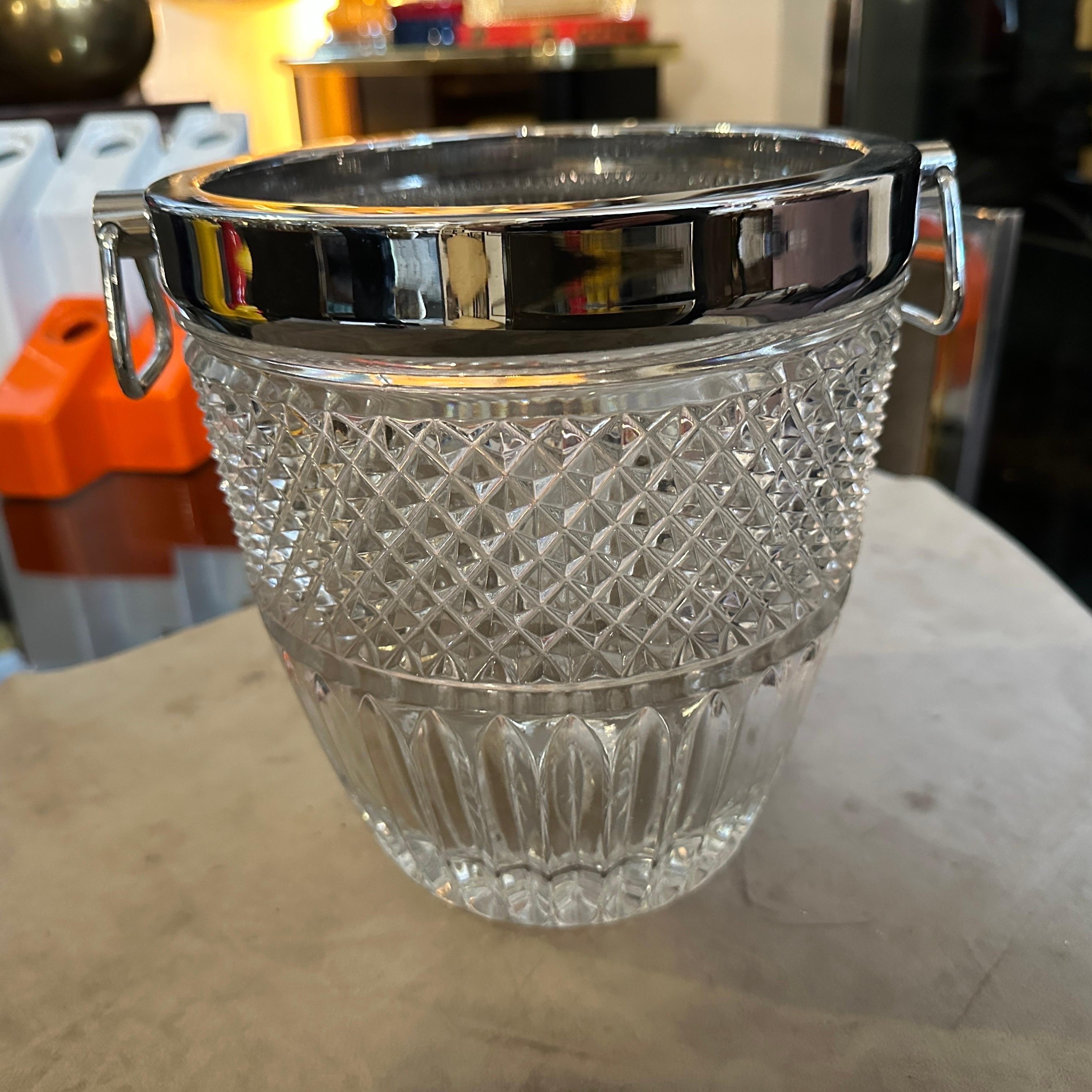 This 1980s Modernist French wine cooler is an elegant blend of luxury and functionality. It features a stunning heavy crystal body with a textured diamond-cut pattern, which enhances its brilliance and allows light to reflect beautifully. The