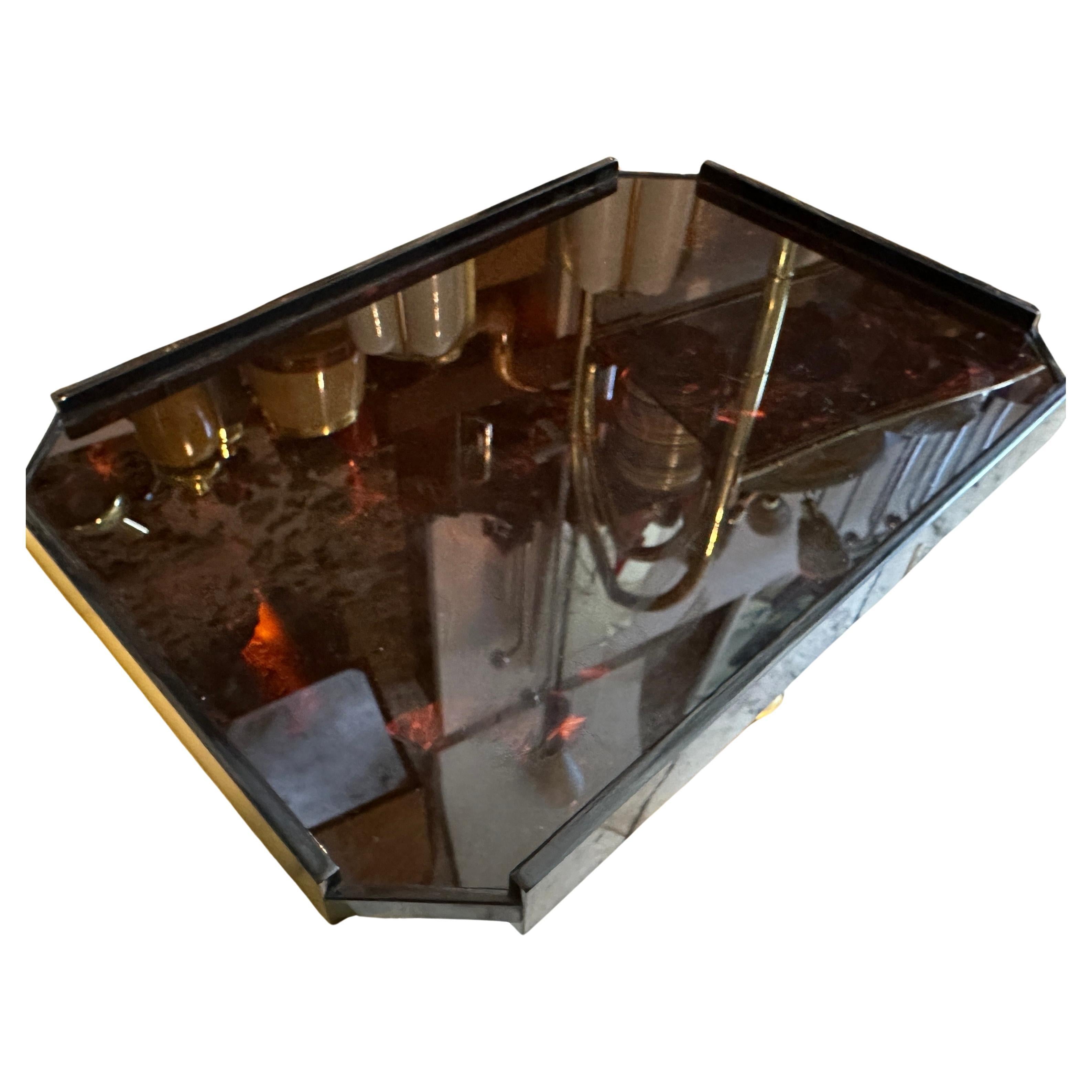 An octagonal serving tray manufactured in Italy in the Eighties, one side is fake tortoise shell lucite, the other side had been made of real bamboo inside transparent lucite, an elegant black frame completes the design of this tray. 
It is a
