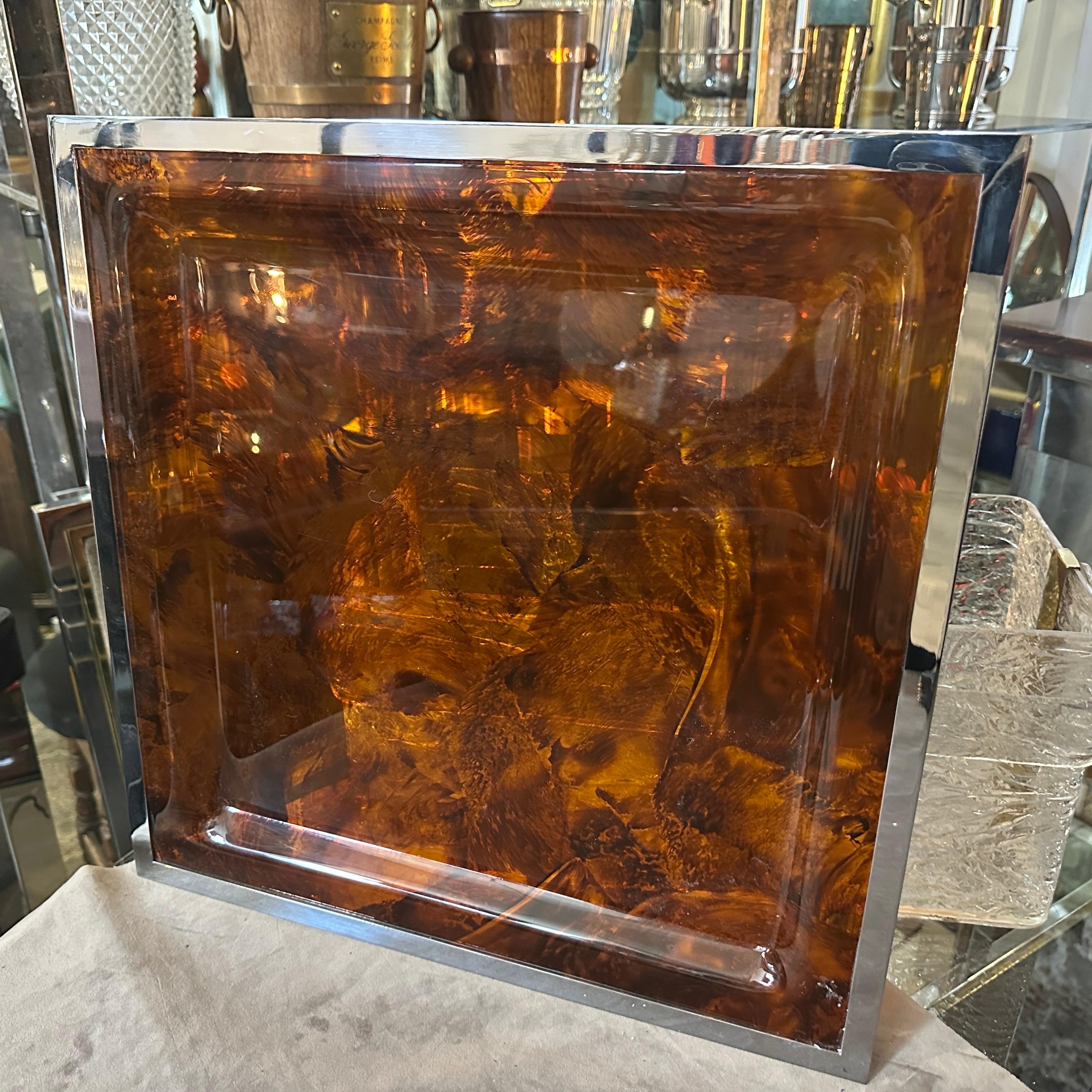 This square Tray by Ulderico Cavinato embodies the spirit of its era, blending cutting-edge materials with timeless design principles to create a visually stunning and functional work of art, it exemplifies the sleek and avant-garde design