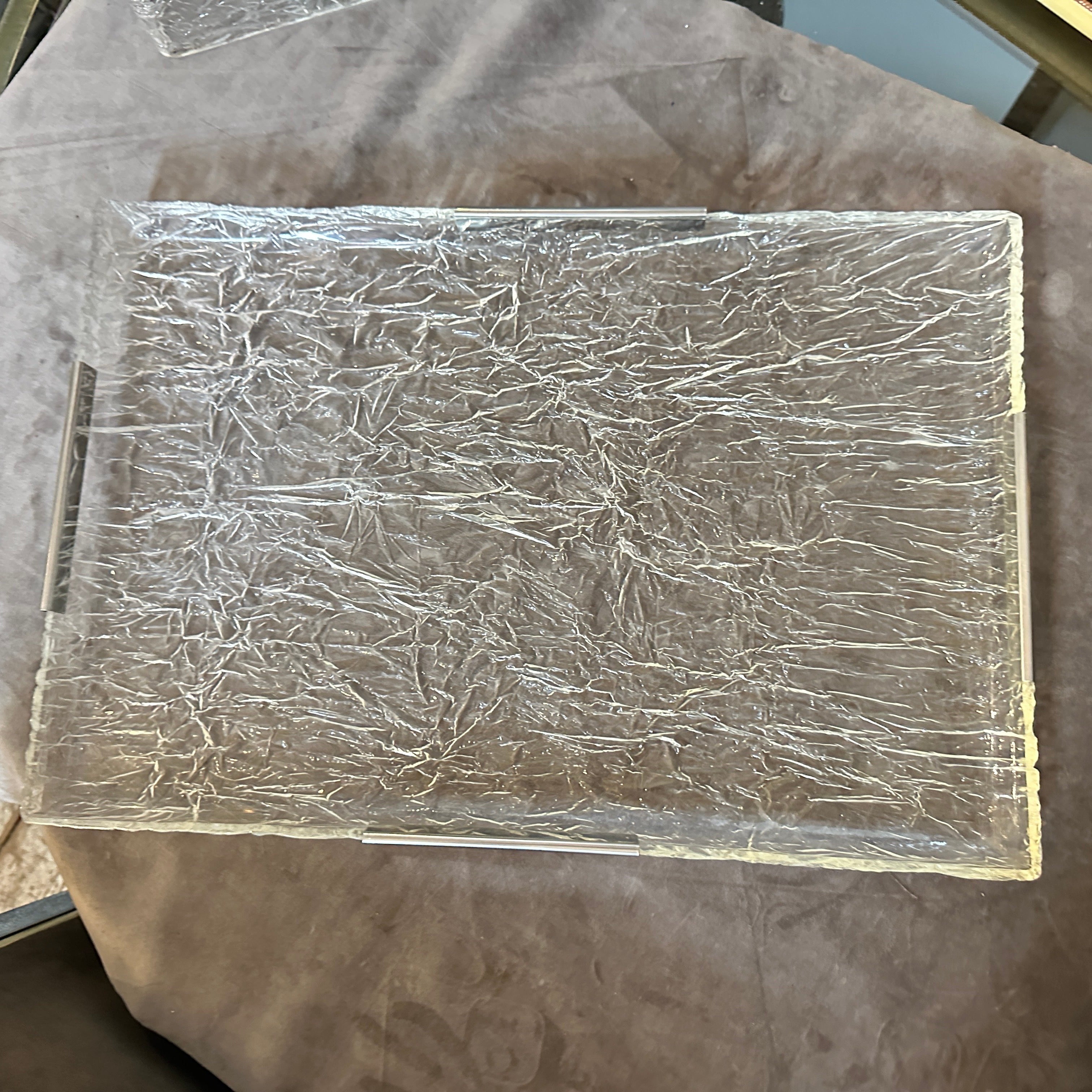 This Tray by Ulderico Cavinato embodies the spirit of its era, blending cutting-edge materials with timeless design principles to create a visually stunning and functional work of art, it exemplifies the sleek and avant-garde design sensibilities of
