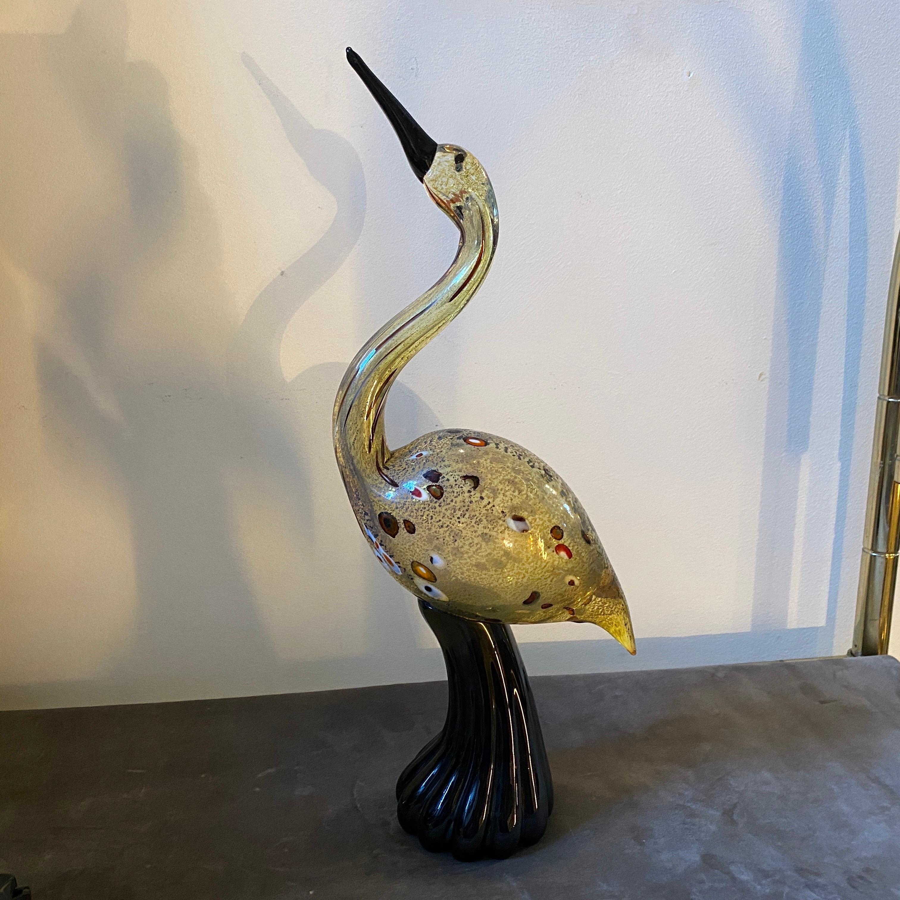 An amazing hand-crafted sculpture of a Flamingo designed and manufactured in Murano by Luigi Mellara. It's signed on the bottom Mellara L. It's in perfect conditions. The Murano Glass Flamingo by Luigi Mellara is a captivating and exquisite piece of