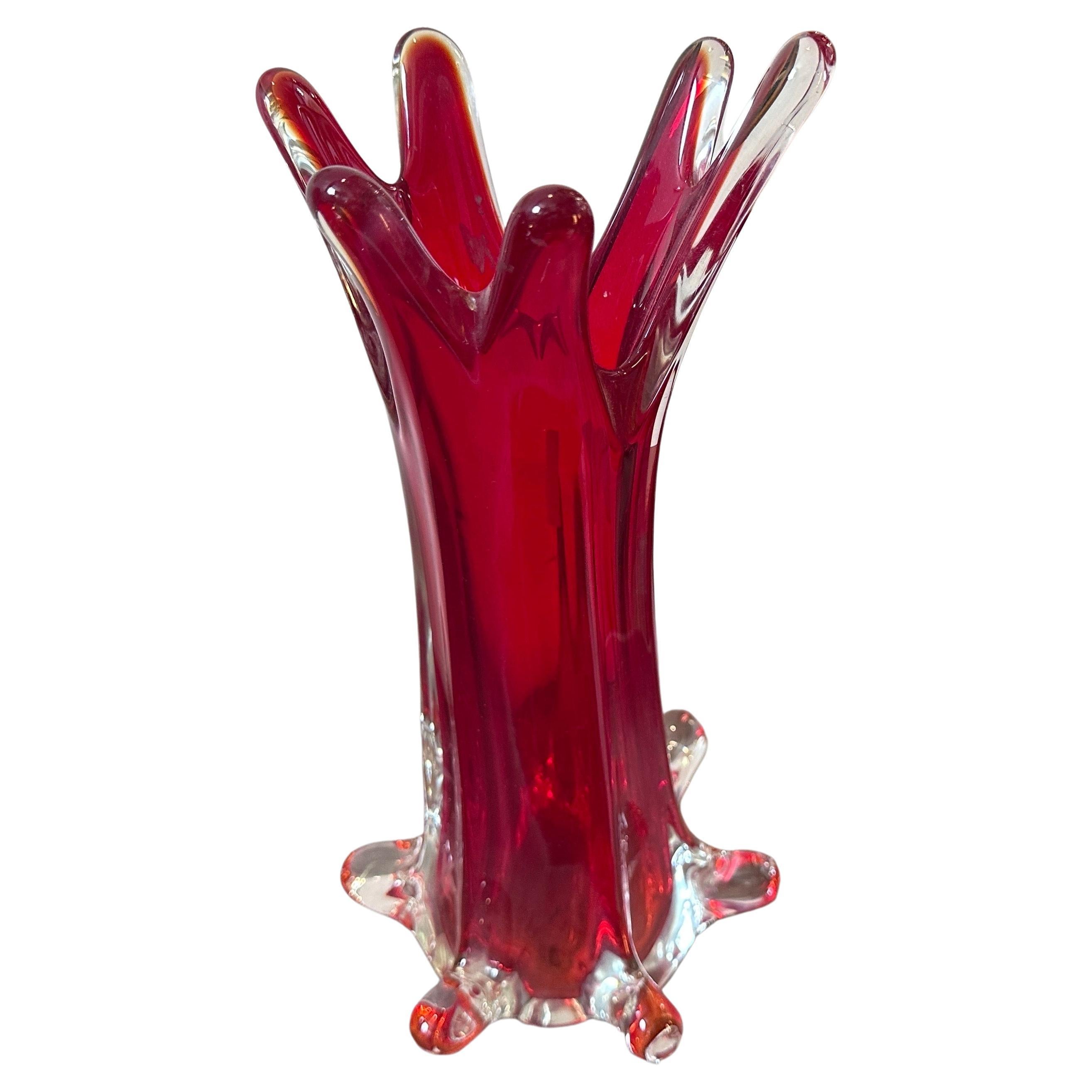 A red sommerso murano glass vase designed and manufactured in Venice By Seguso in the Eighties, vase it's in perfect condition. This Tall Vase by Seguso it's a beautiful and collectible piece of art glass. Murano glass refers to glassware produced