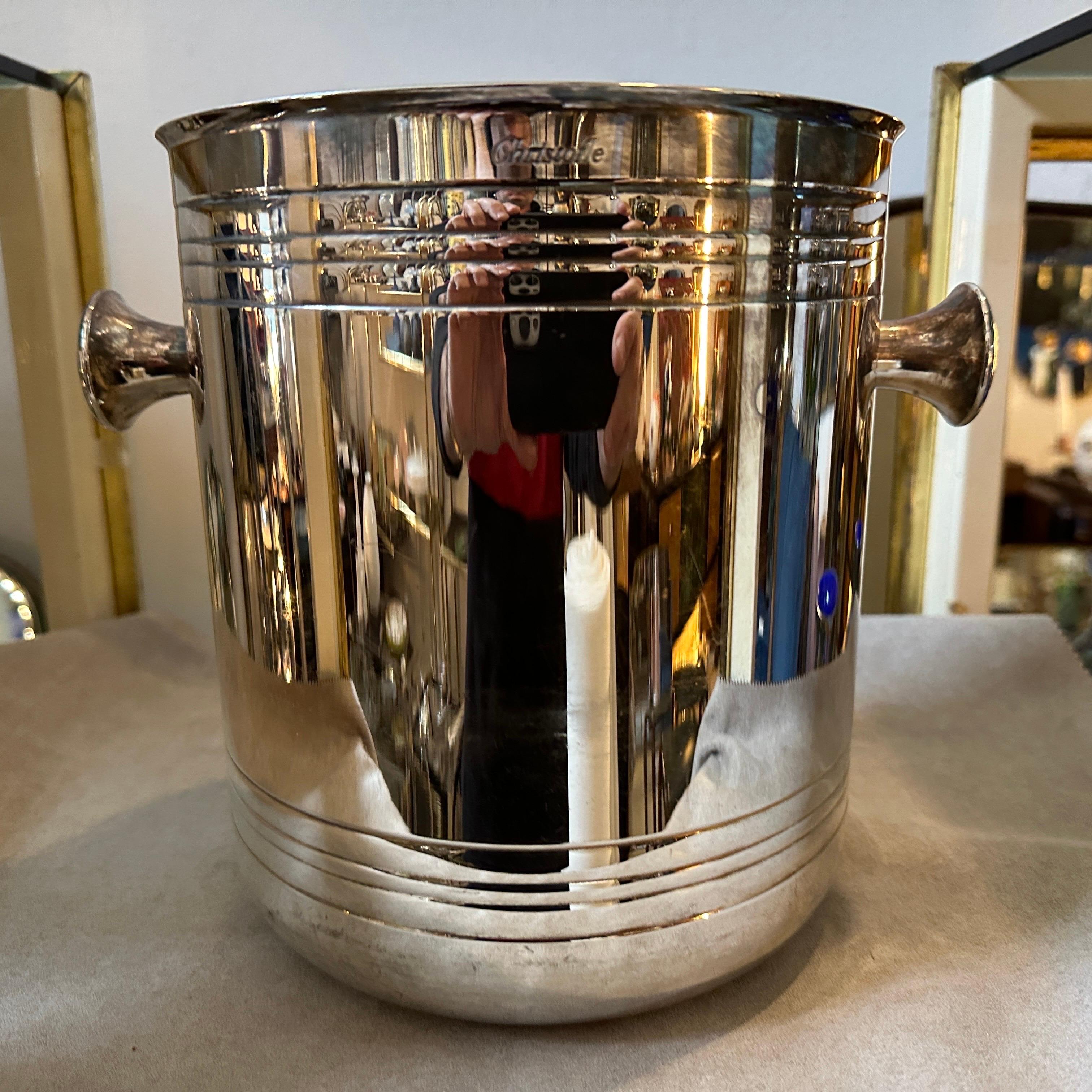 This French Wine Cooler by Christofle is a sleek and elegant piece of barware, reflecting the minimalist and contemporary design trends of the era. It has been crafted from high-quality silver-plated metal. Silver plating provides a luxurious finish