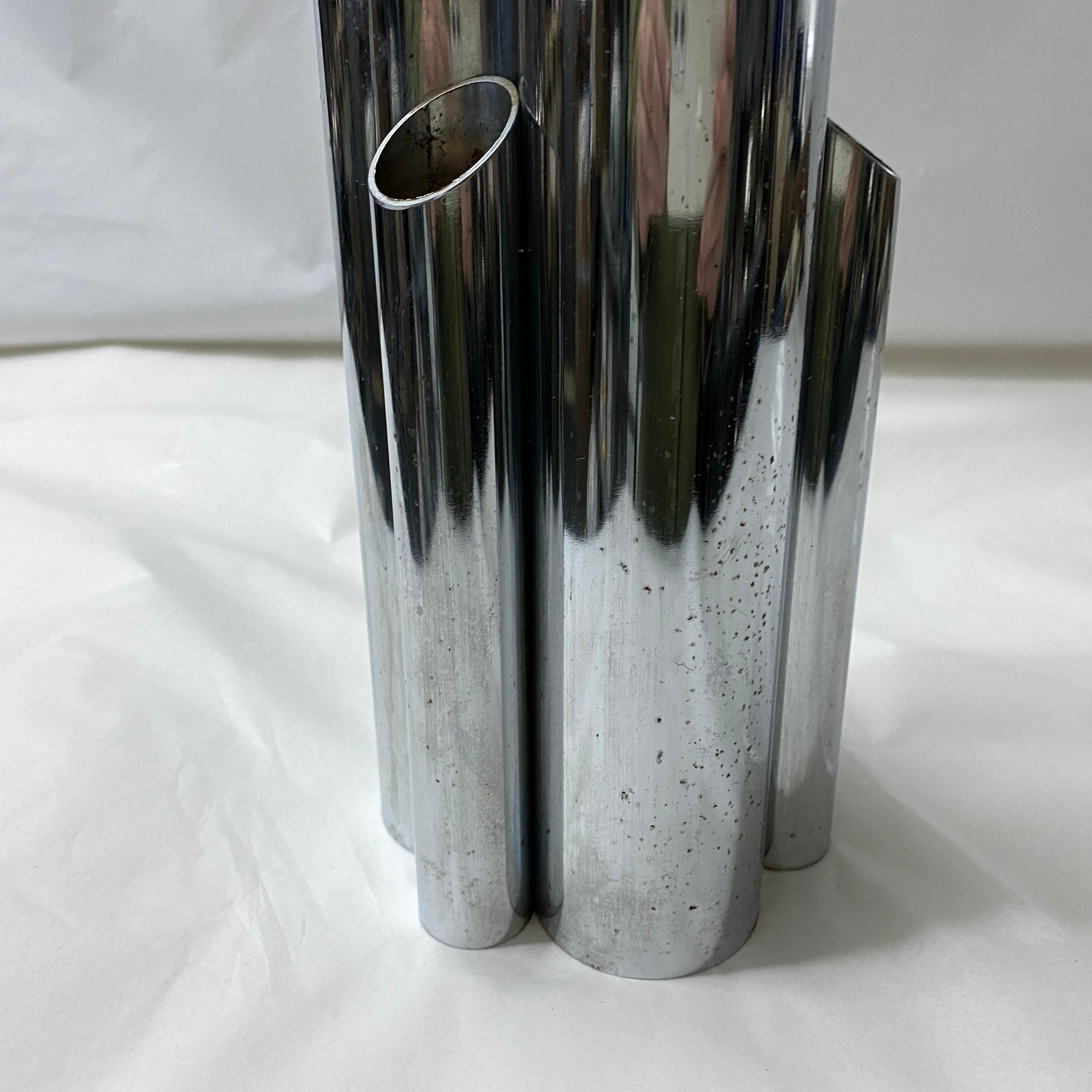 A silver plated multi pipes vase designed and manufactured in Italy in the Eighties, good conditions overall. The vase is a striking example of Italian design from that era. Inspired by the renowned architect and designer Giò Ponti, this vase