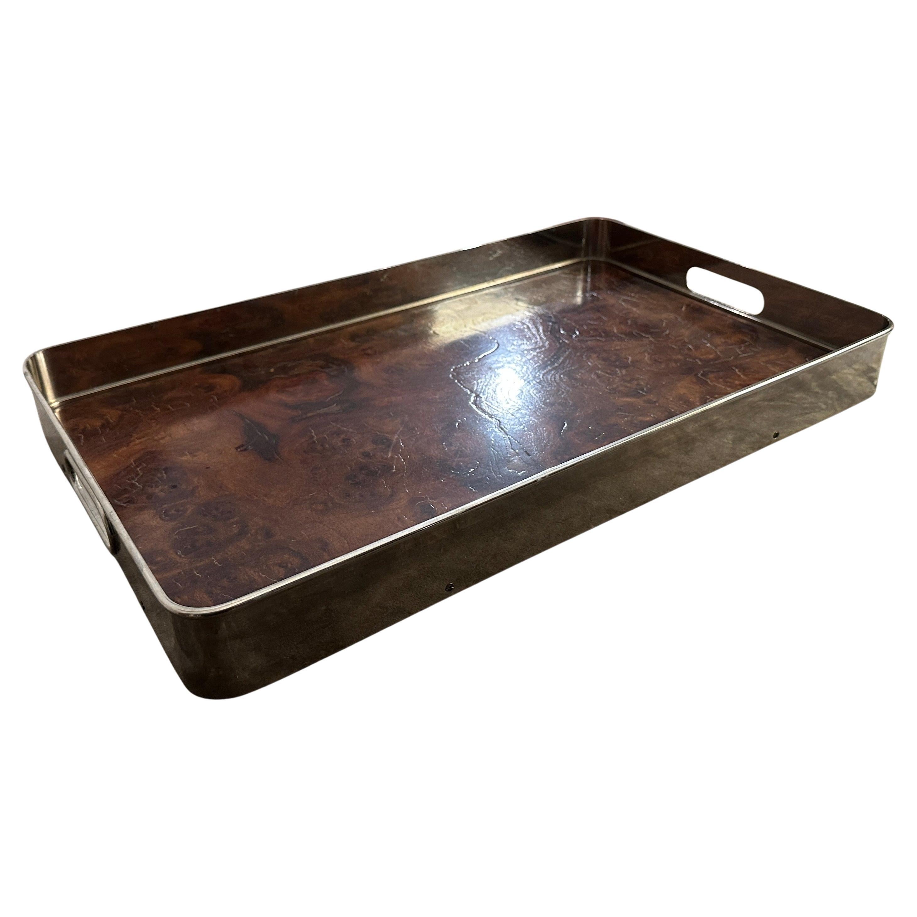 This Italian Serving Tray is a sophisticated blend of natural luxury and sleek design, characteristic of modernist aesthetics from that era. Crafted from Thuya briar wood, features a rich, dark brown hue with intricate grain patterns that add a