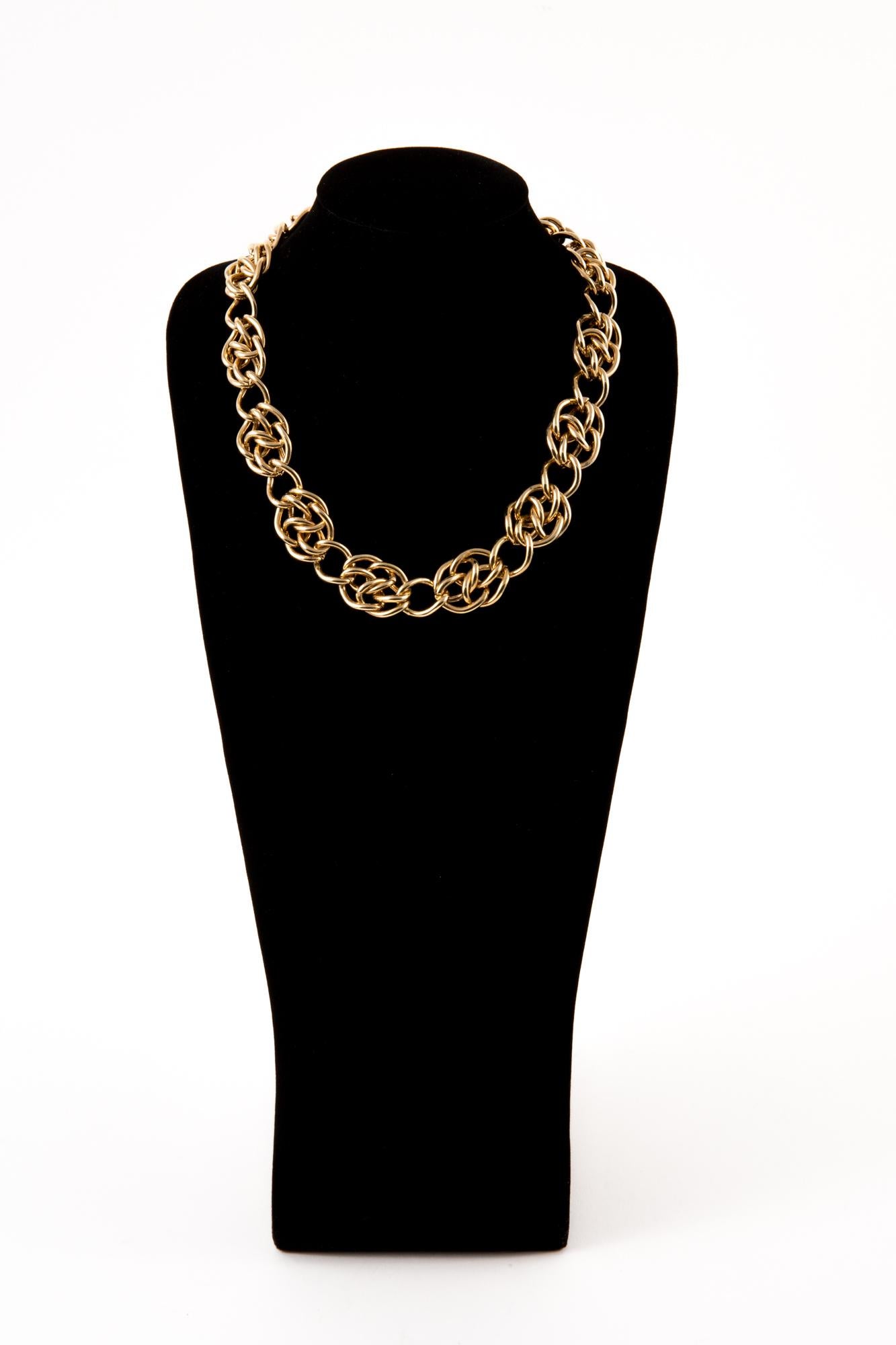 1980s Monet gold-tone chain choker necklace featuring a back round magnet fastening, pitted at back round opening. 
Length 18.1in. (46cm)  
In excellent vintage condition.  Made in US.
We guarantee you will receive this gorgeous earrings as