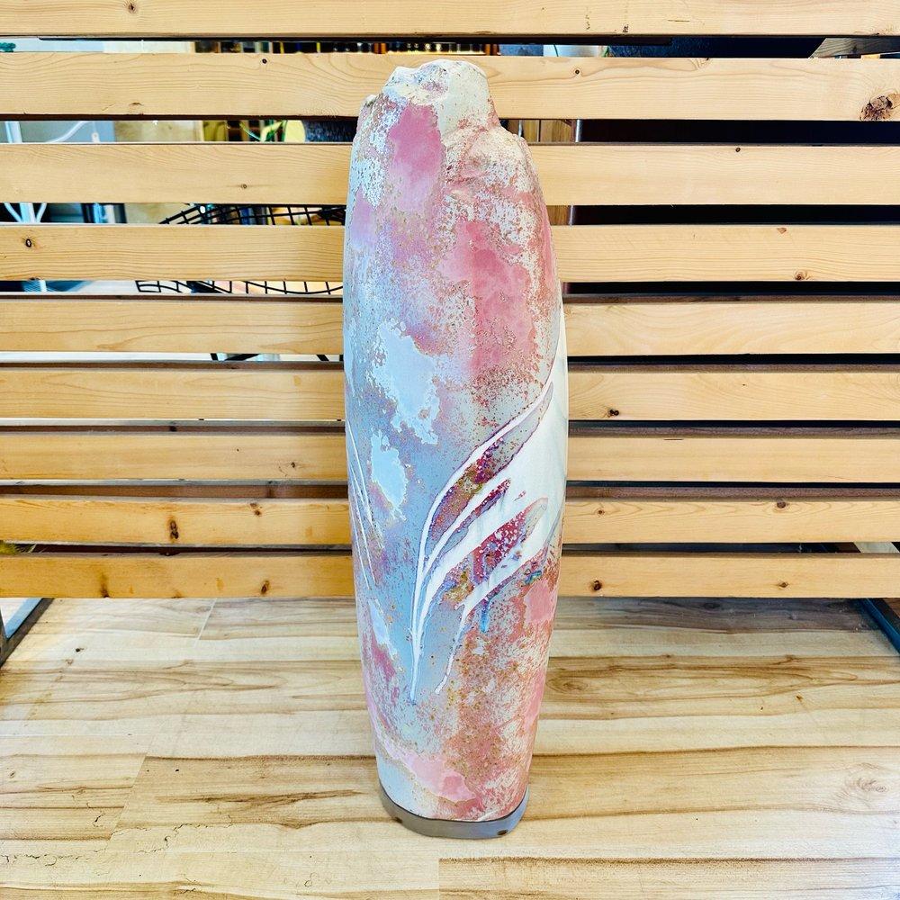The 1980s monumental Raku pottery floor vase by Tony Evans showcases the artist's mastery in combining traditional pottery techniques with contemporary design sensibilities. Standing as an impressive symbol of the era's artistic expression, this