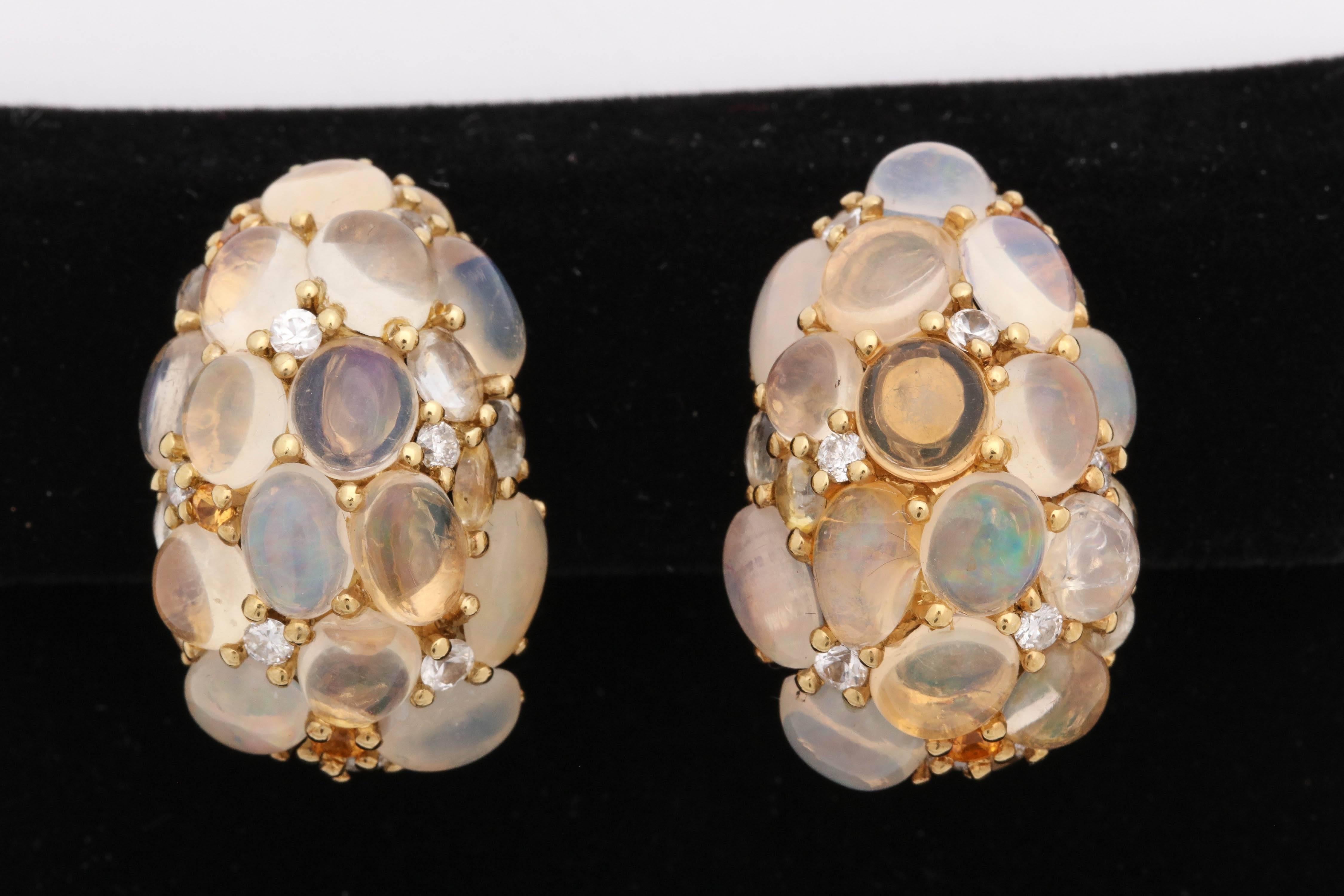 One Pair Of Ladies 18kt Yellow Gold Bombe Style Earrings With Retractable Posts.Earclips Are Designed With Numerous Cabochon Moonstones And Opals And Citrines. Earrings Also Have Sporatic Diamonds Thruout The Design Of the Earrings.Signed MCC And