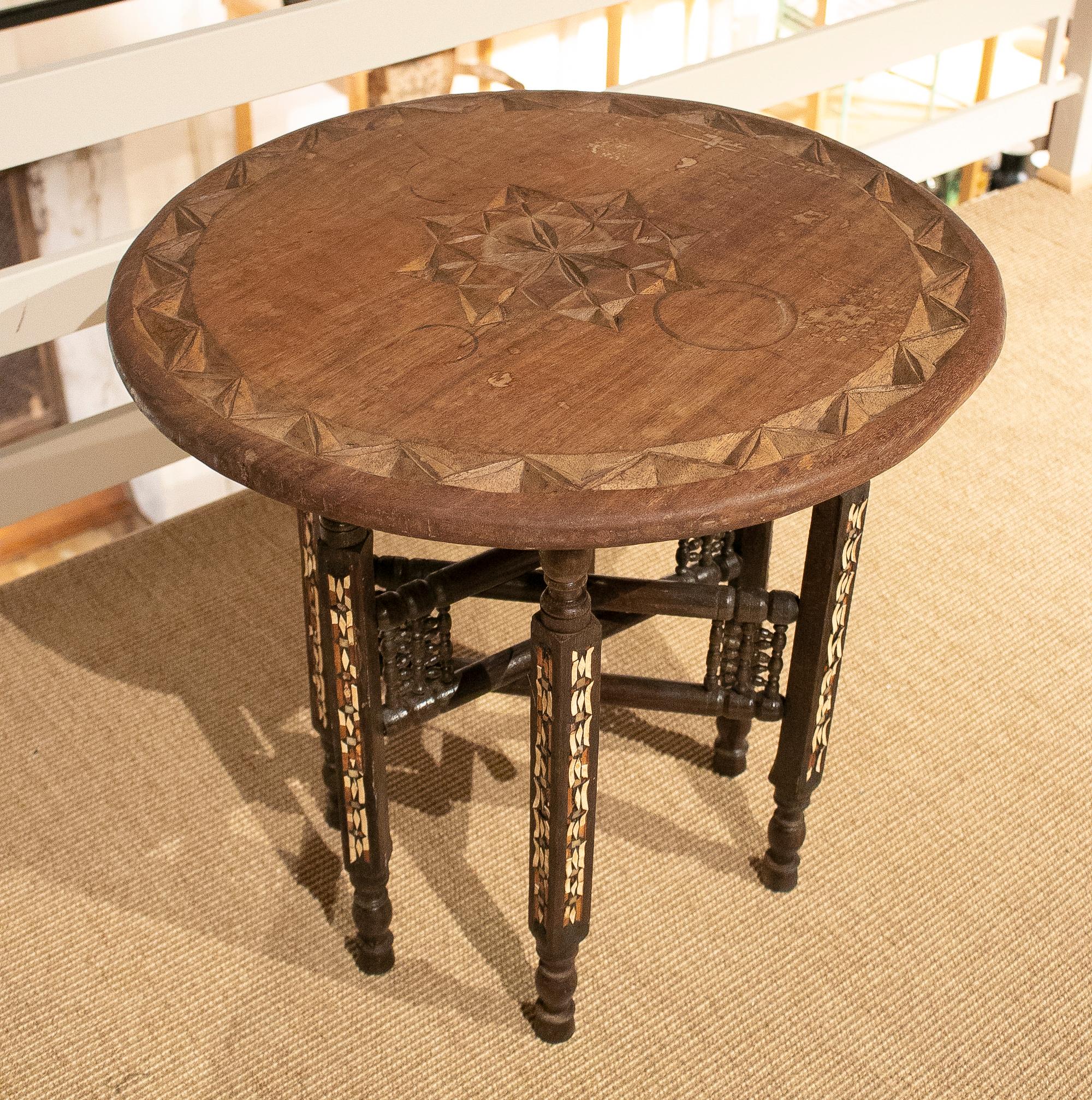 1980s Moroccan hand carved round wooden inlay table.