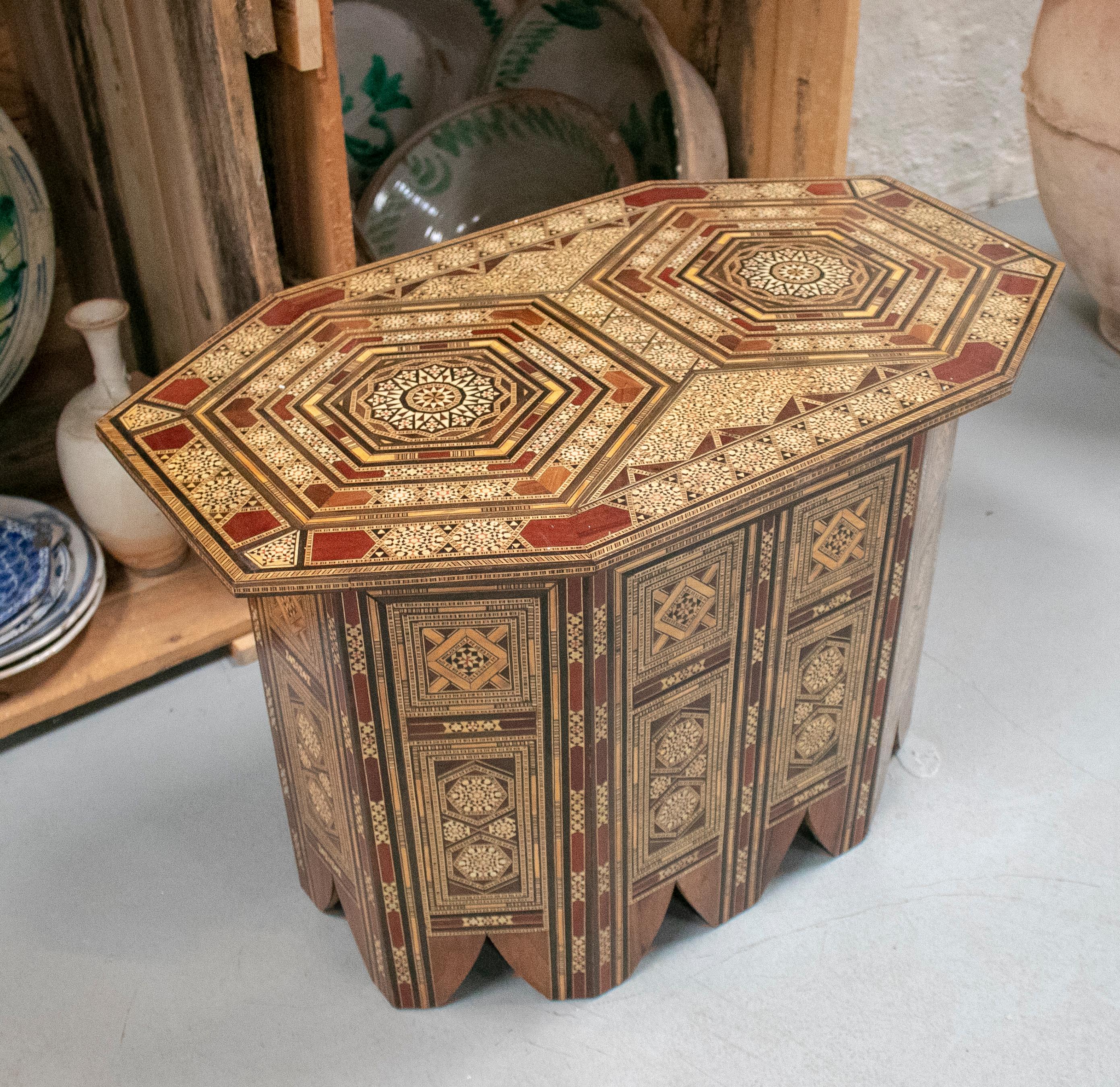 1980s Moroccan inlay wooden table with ornamental geometric decorations.