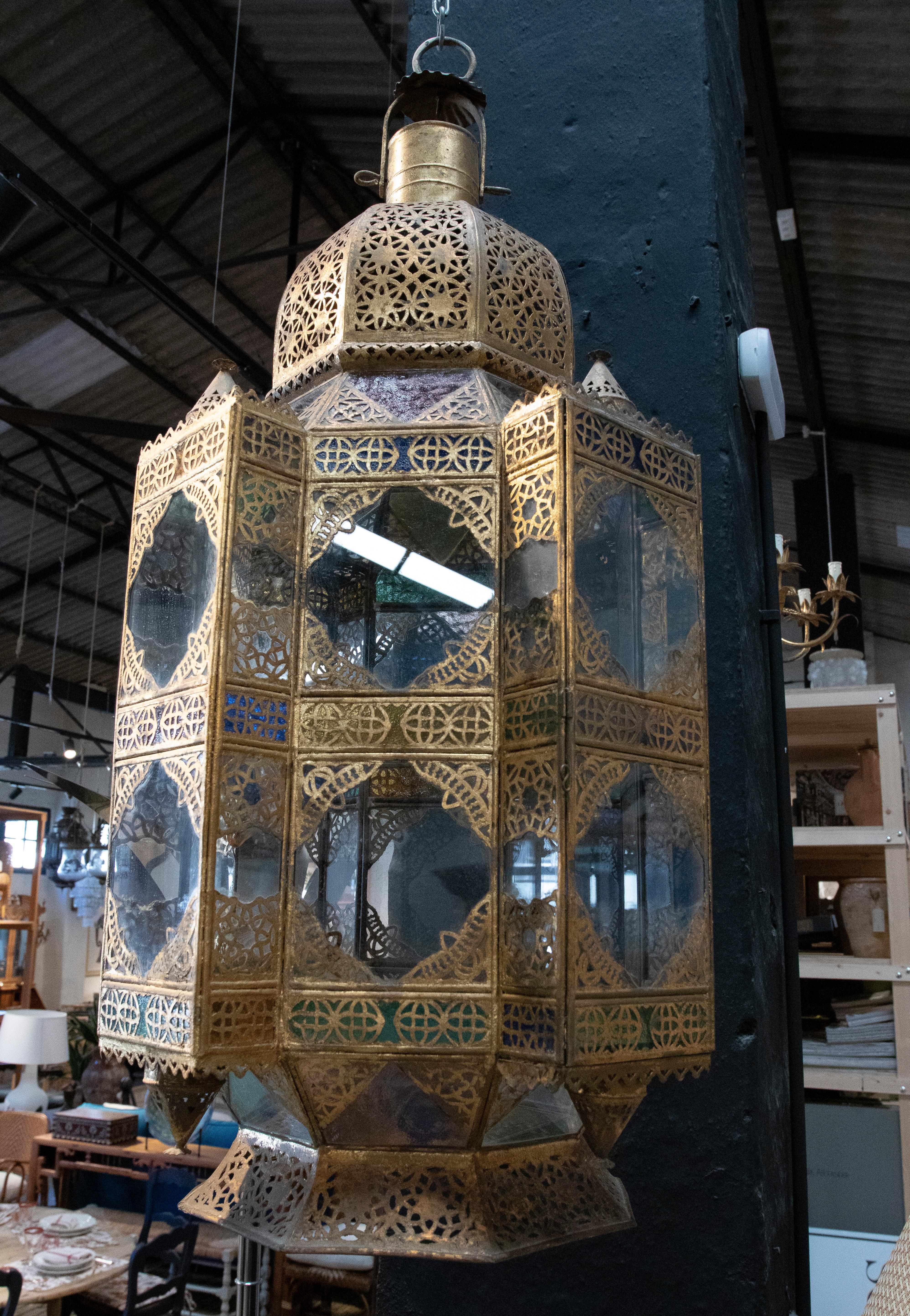 Ethnic 1980s Moroccan iron hanging lantern lamp with coloured glass.
