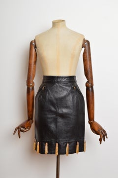1980's Moschino Black Leather Pencil Skirt with Gold Thimble decoration Tassels