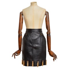 1980's Moschino Black Leather Pencil Skirt with Gold Thimble decoration Tassels