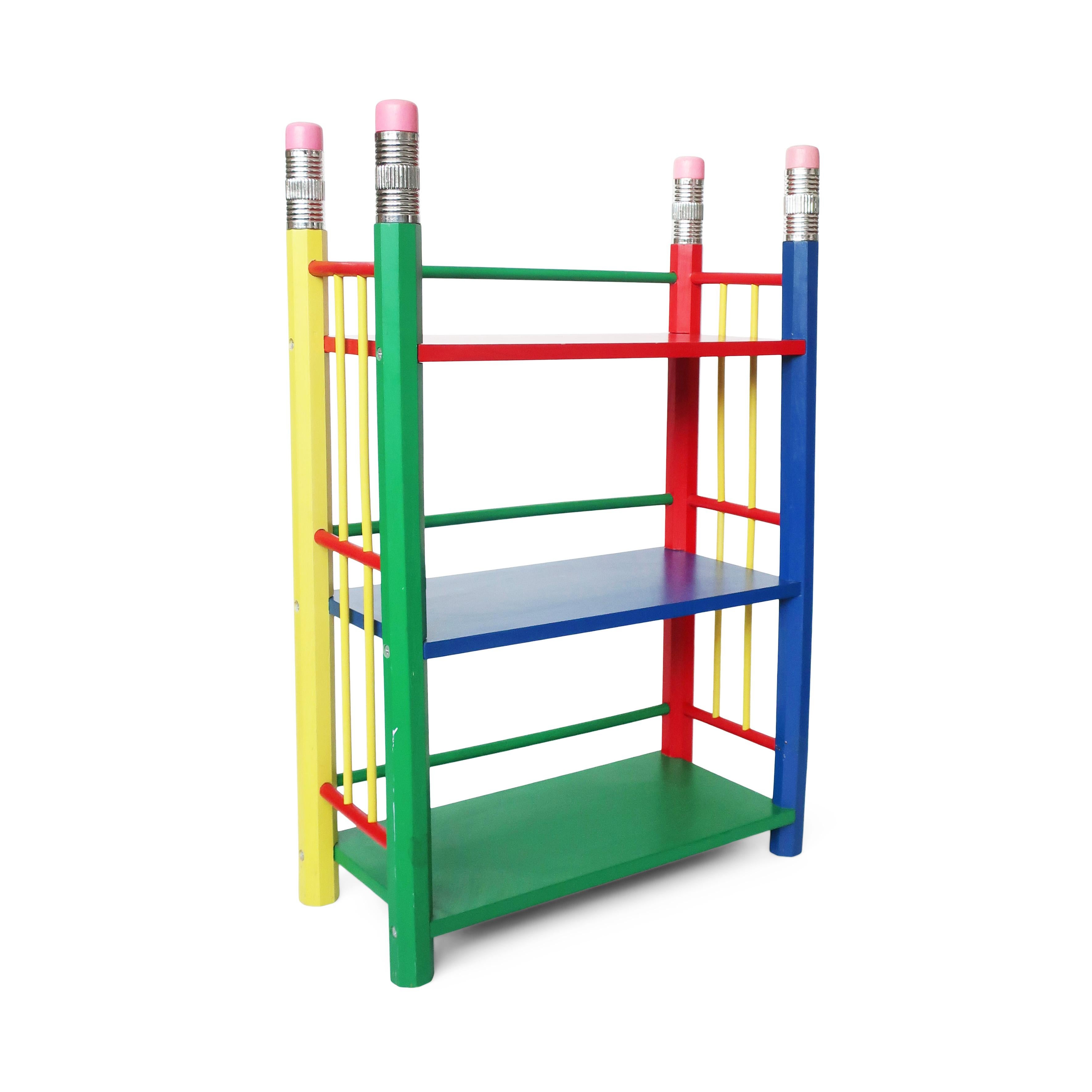 A great postmodern bookshelf from Pierre Sala's pencil themed furniture from the 1980s for Pierre Sala Furniture. Its striking primarily colored design is composed of three shelves (one blue, one green, and one red) supported by four pencils in red,