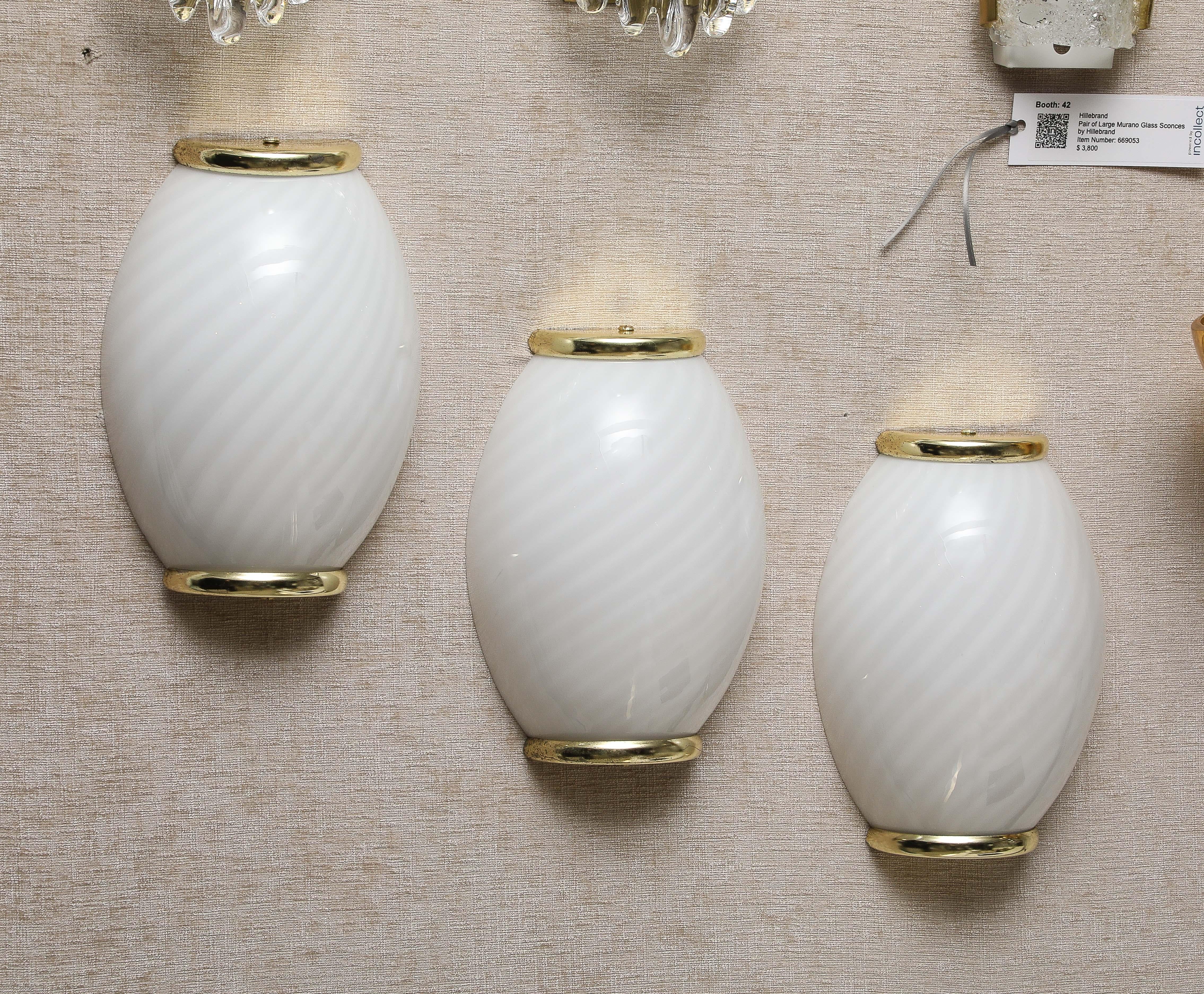 Set of Three Striped Murano Glass and Brass sconces by Fabbian.
The sconces have been Newly rewired for the US and they take a standard Candelabra light bulb  with a Maximum 60 watts