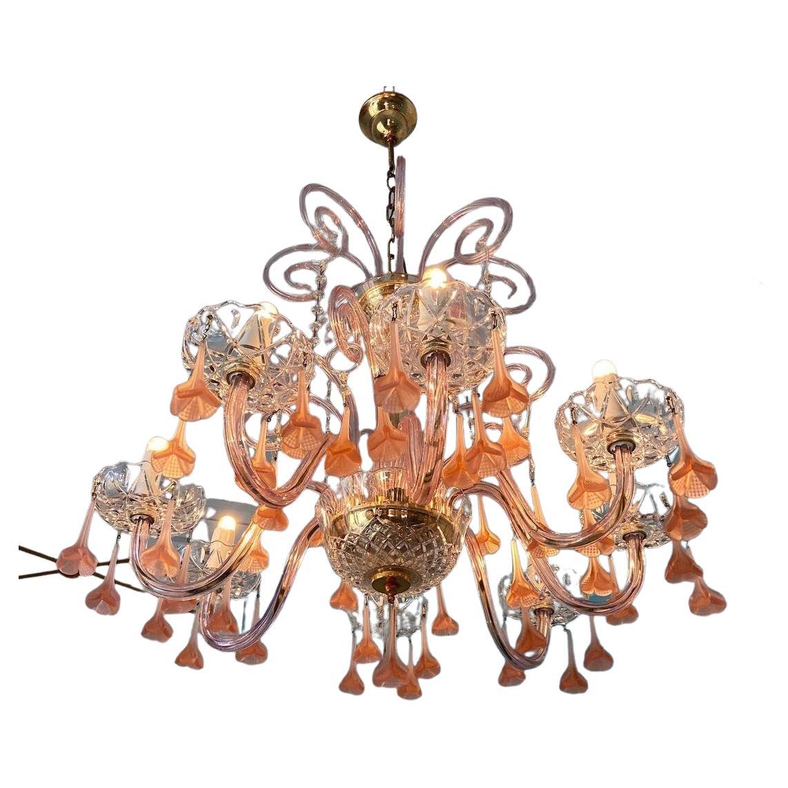 1980s Murano glass chandelier with pink flowers. This light will make any room blossom. 8 light bulbs.
  