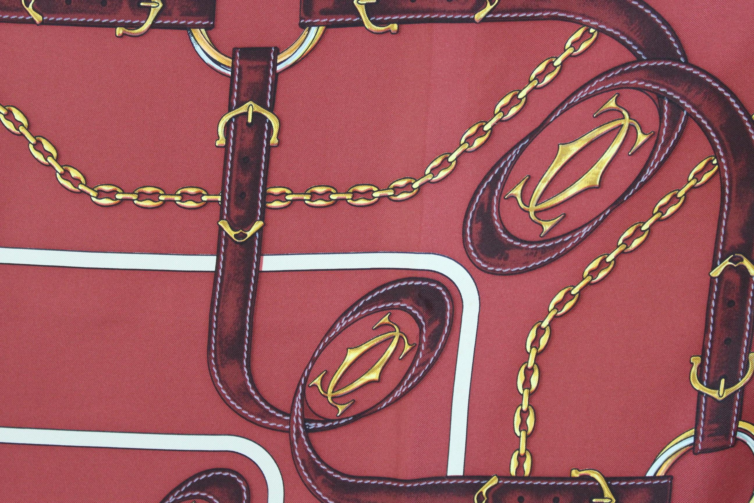 Must De Cartier vintage scarf 1980s. Burgundy color with gold and beige designs. 100% silk. Made in France. Excellent vintage conditions.

Measures: 84 x 84 cm