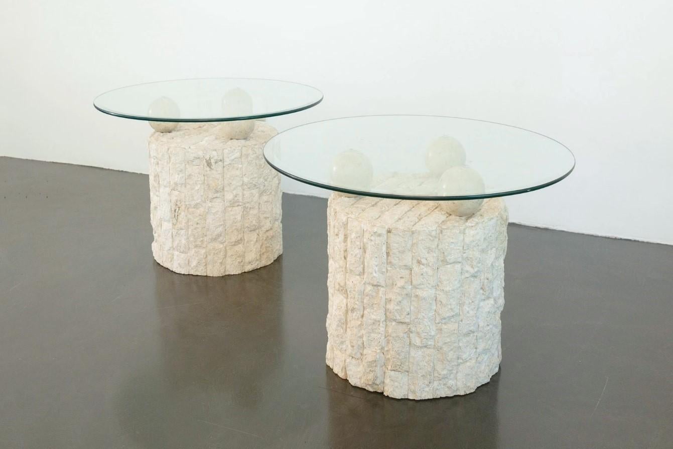 Unique Postmodern 1980s design, freeform end or side tables. Each table base in rough edged brick motif Mactan stone. Three stone balls holding the removable circular glass tops. Can be used both indoors and outdoors. 

Table measured with the