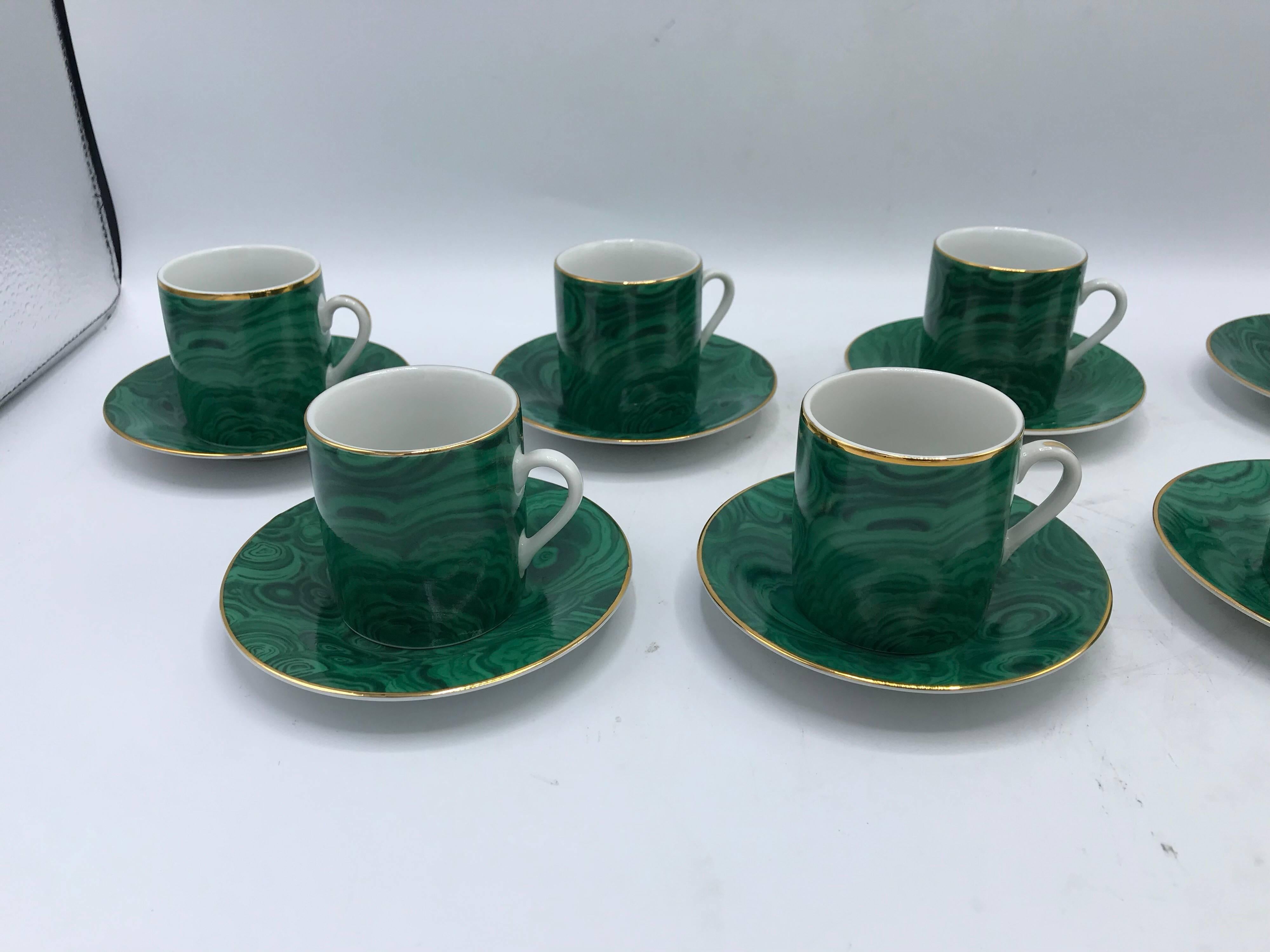 Offered is a stunning set of eight, 1980s Neiman Marcus malachite porcelain teacups and saucers with a gold 24-carat band around the perimeter. Marked ‘Neiman Marcus’ on underside. Made in Japan. Service for eight. Each saucer measures 4.5