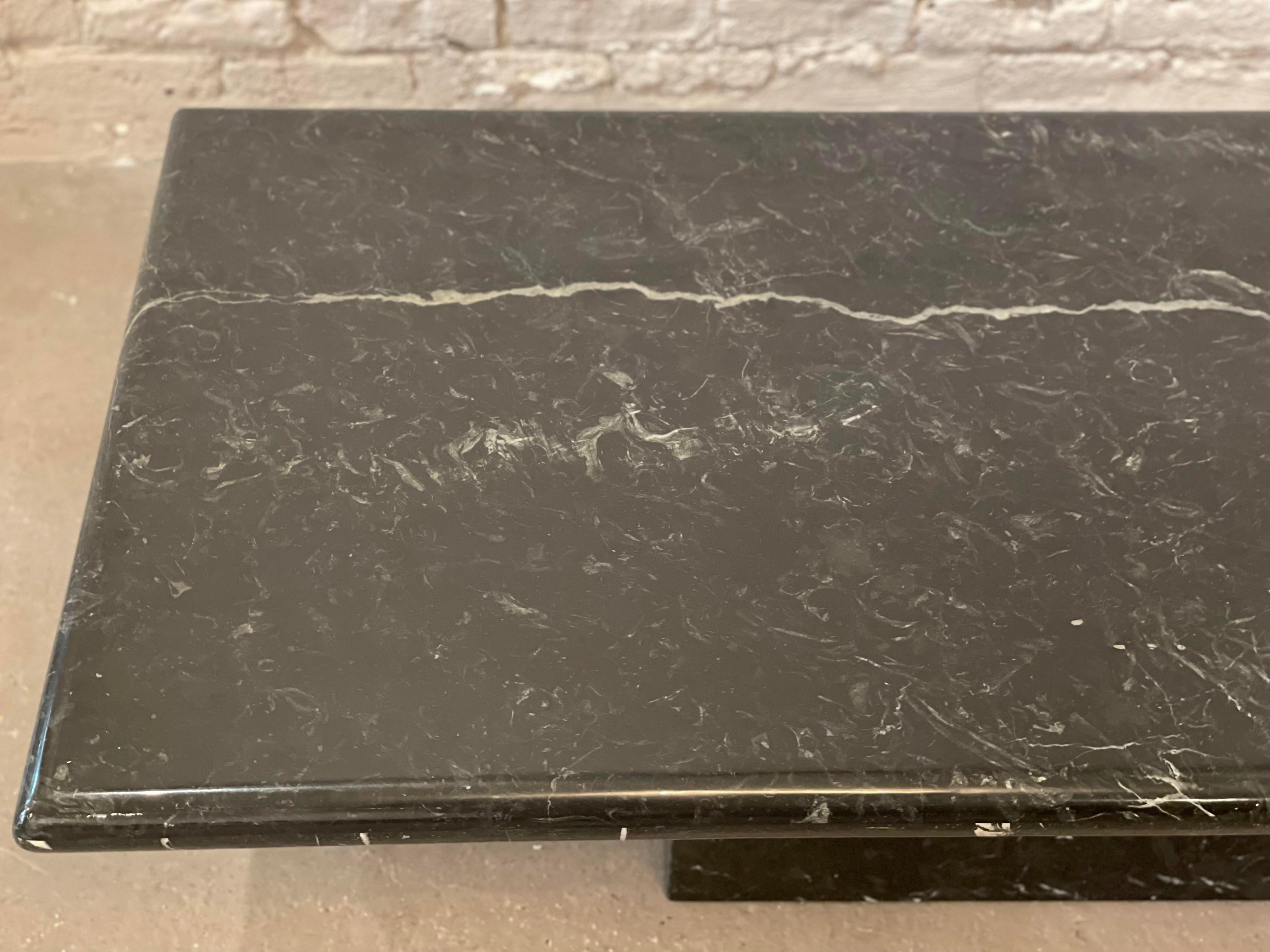 Beautiful slab of Nero Marquina, it’s almost all black with one corner covered in ivory veining. The original lacquer is in excellent condition. The table top is attached to the base making this kid friendly as well.