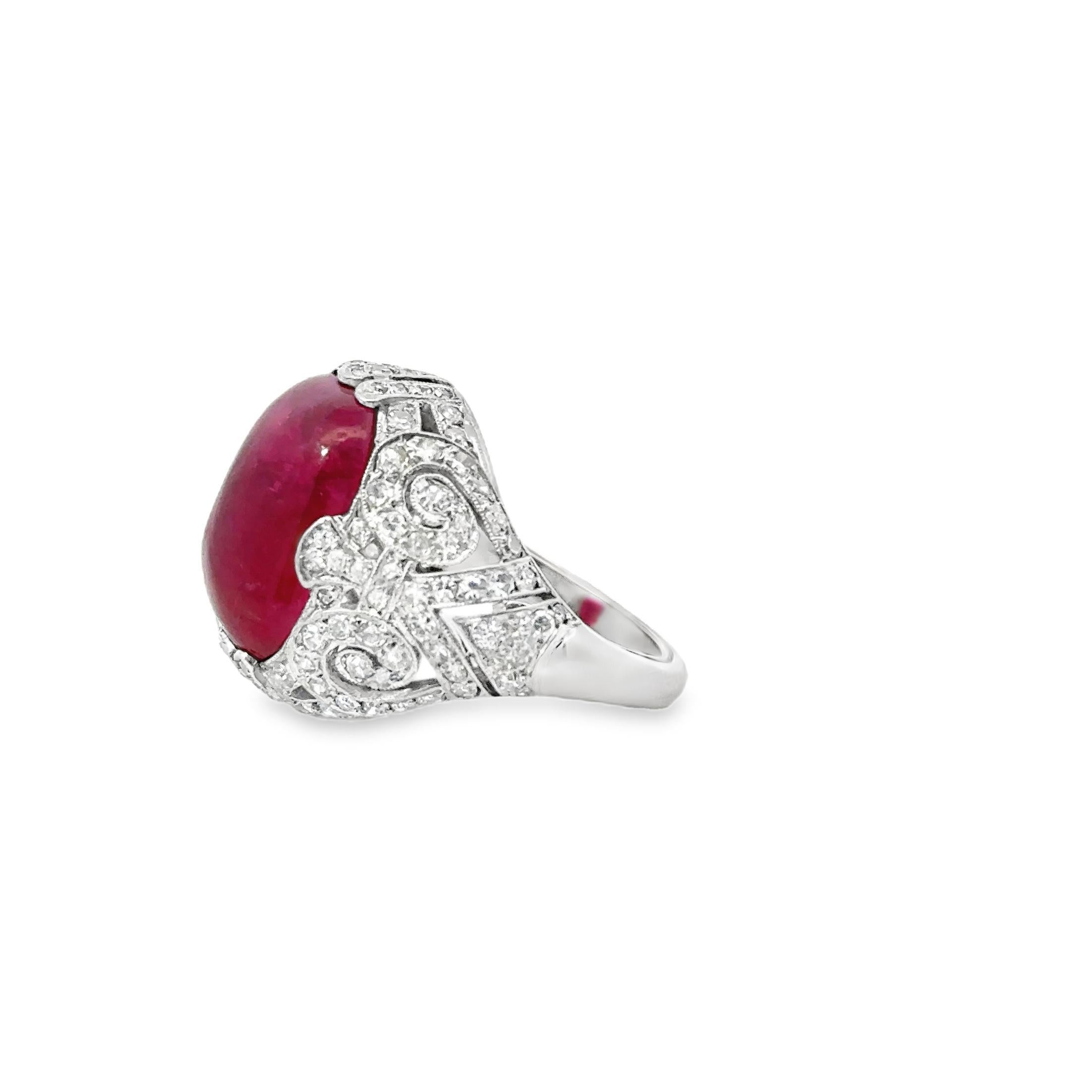There’s red, and then there’s this a cabochon ruby the color of silk soaked in sunlight and secrets. Burmese origin. No heat. Just purity.

The stone 15 carats, unflinching—is set in a platinum mount iced with 1.27 carats of white diamonds, each one