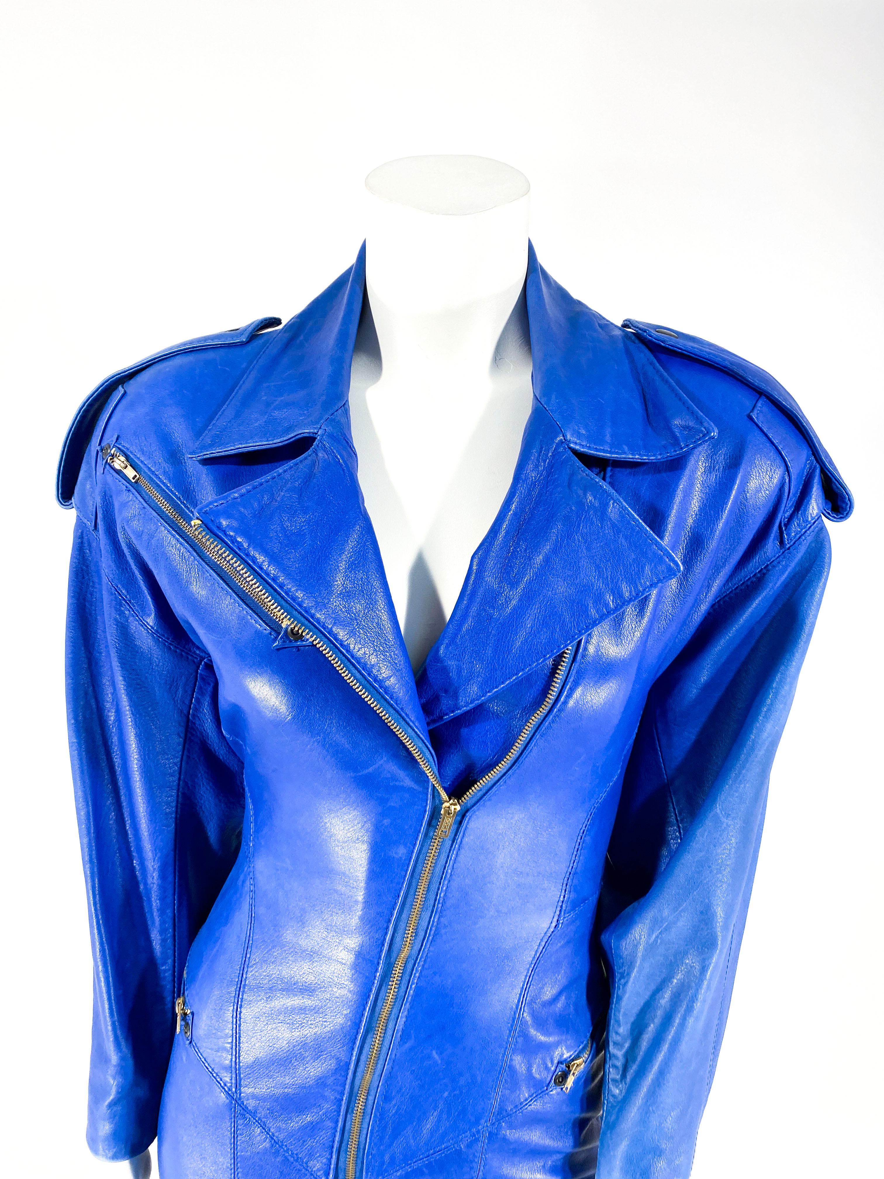 1980s North Beach leather blue coat dress with zipper decorations, and a long angled sip closure in the front. 