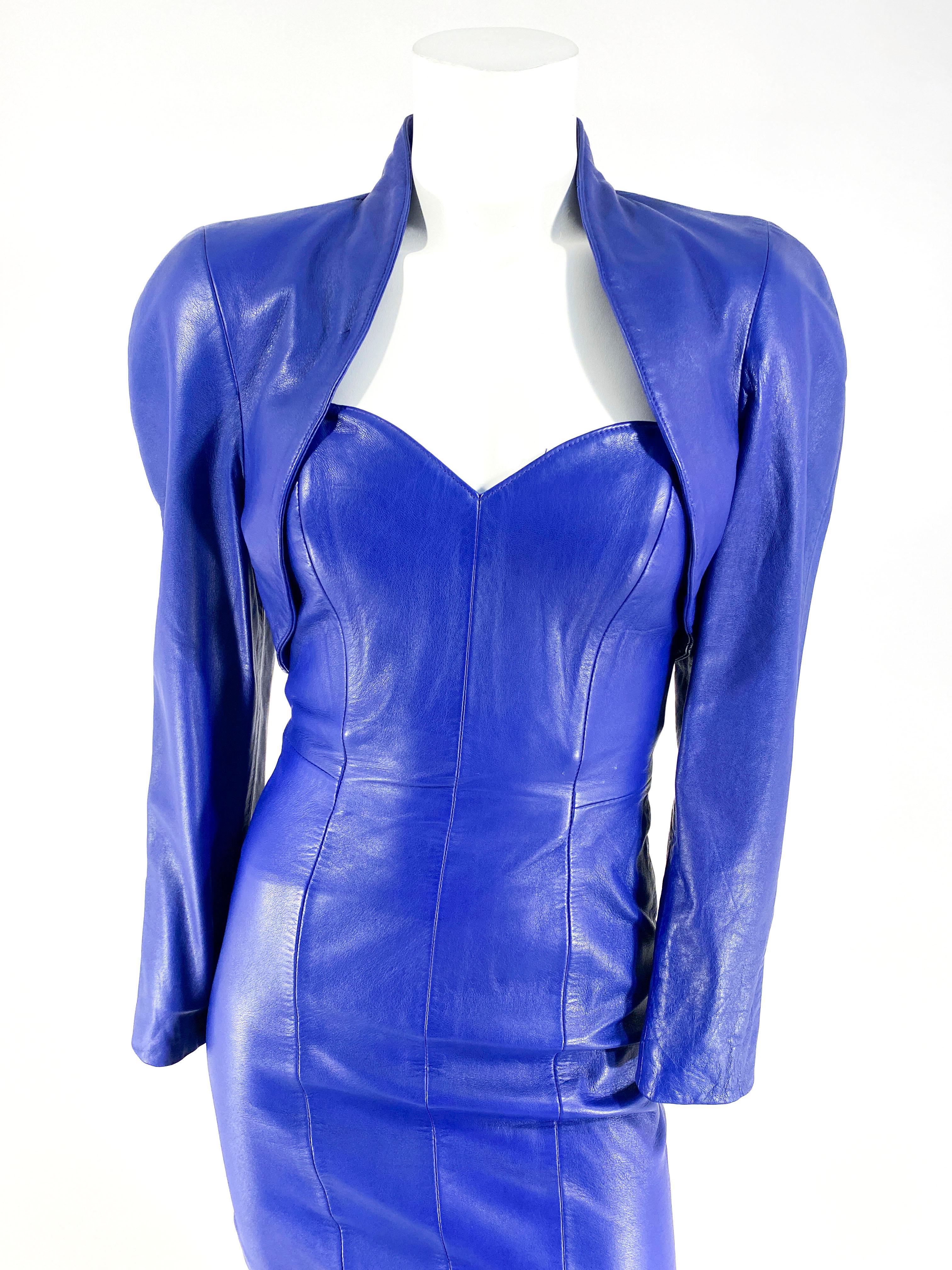 1980s North Beach Leather Eggplant Purple strapless leather dress with a zip back closure. The matching bolero jacket has full-length sleeves, full-padded shoulders, full lining, and no closure. Petite size US 4/5