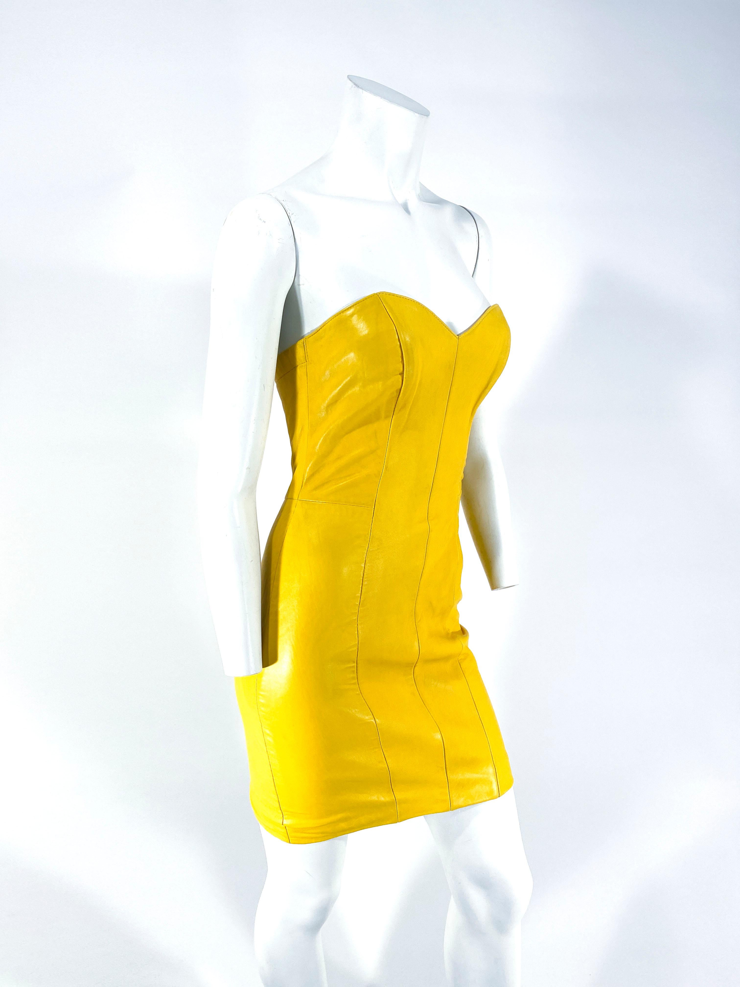 1980s North Beach Leather Mustard Yellow Mini-dress with full lining, strapless bodice, zip back closure, and boning in the bust for structure.