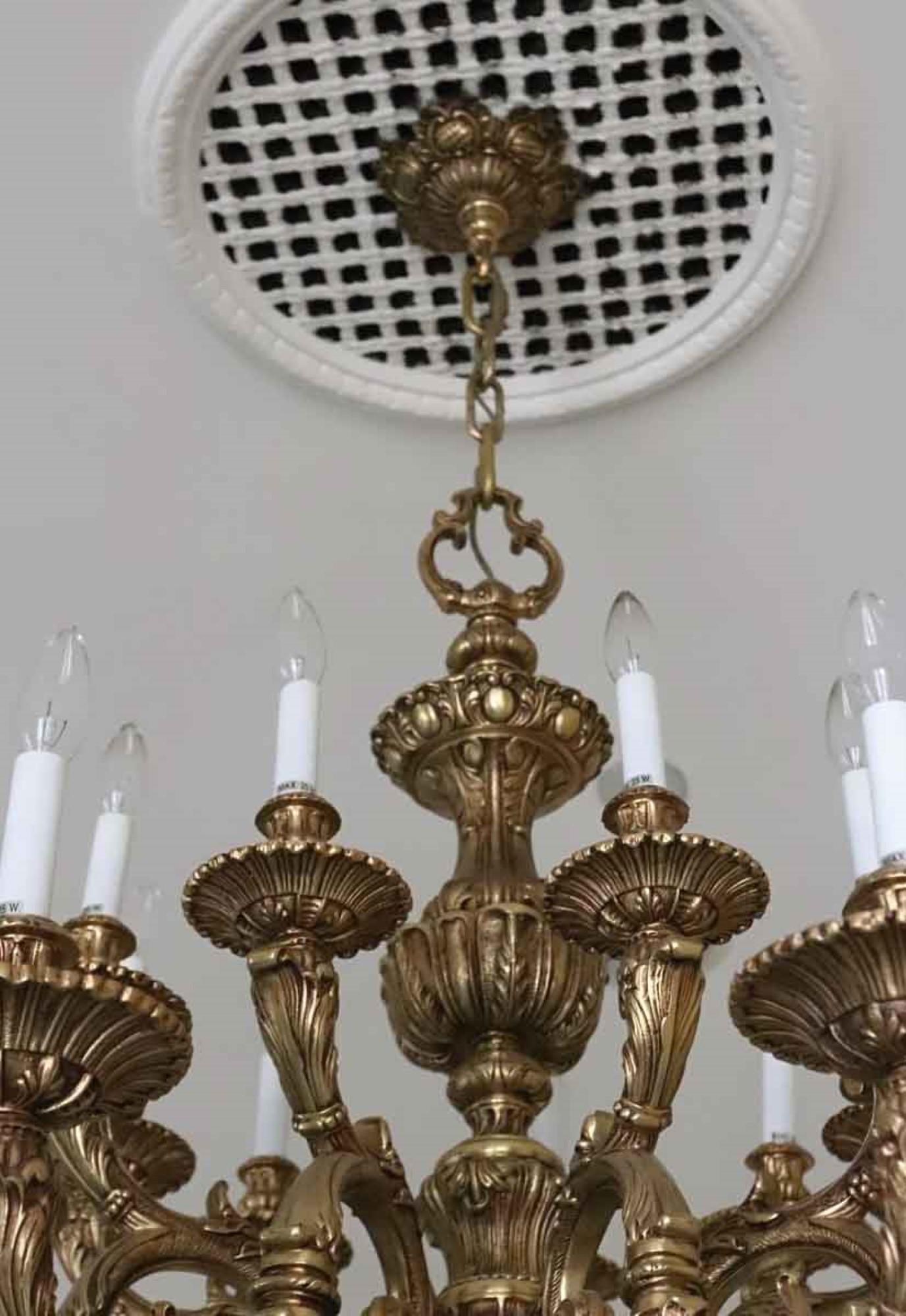 This bronze chandelier is heavily cast and is decorated with six arms and 18 lights. Elaborate details grace this piece which was carefully removed from the Waldorf Astoria banquet room on the 18th floor. A Waldorf Astoria authenticity card included
