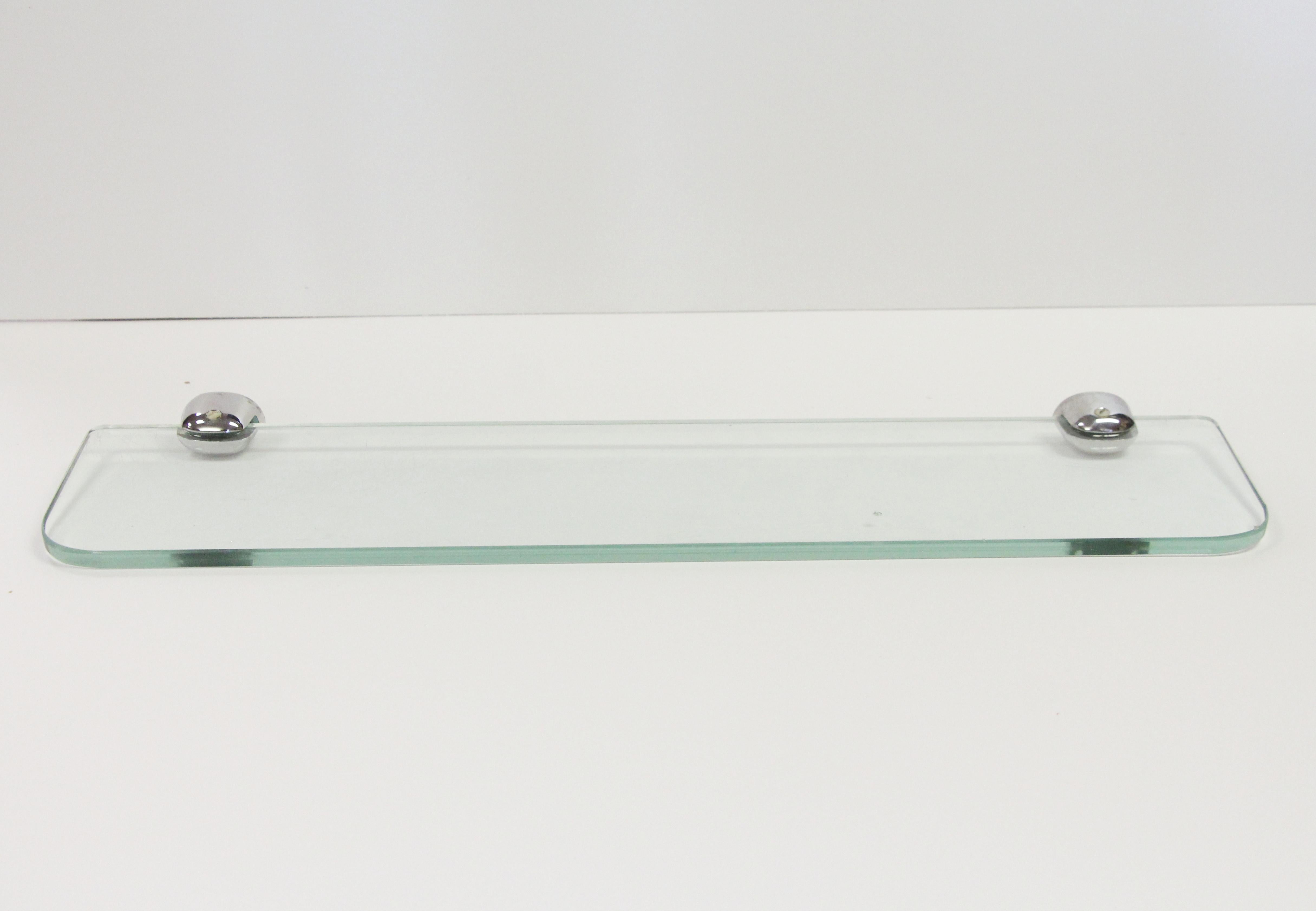 1980s NYC Waldorf Astoria Hotel clear glass horizontal bathroom shelf with nickel-plated brackets. A Waldorf Astoria authenticity card included with your purchase. Small quantity available at time of posting. Please inquire. Priced each. This can be