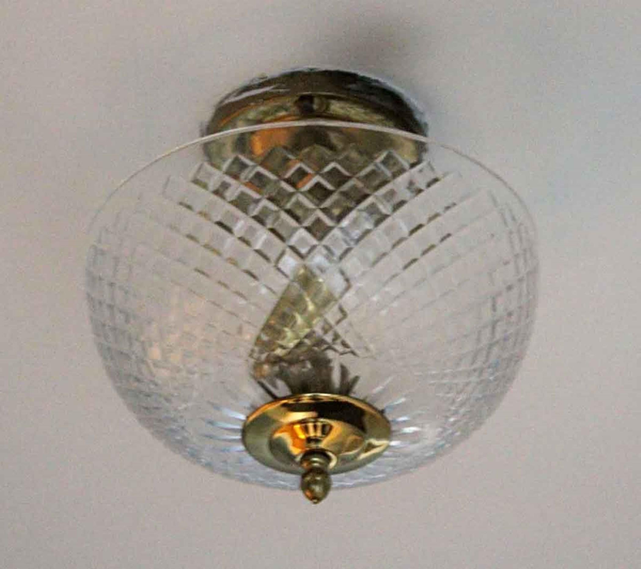 20th Century semi-flush mount ceiling light fixture with clear cut crystal dish and brass hardware. These lights adorned various rooms and corridors of the NYC Waldorf Astoria Hotel on Park Ave. Waldorf Astoria authenticity card included with your