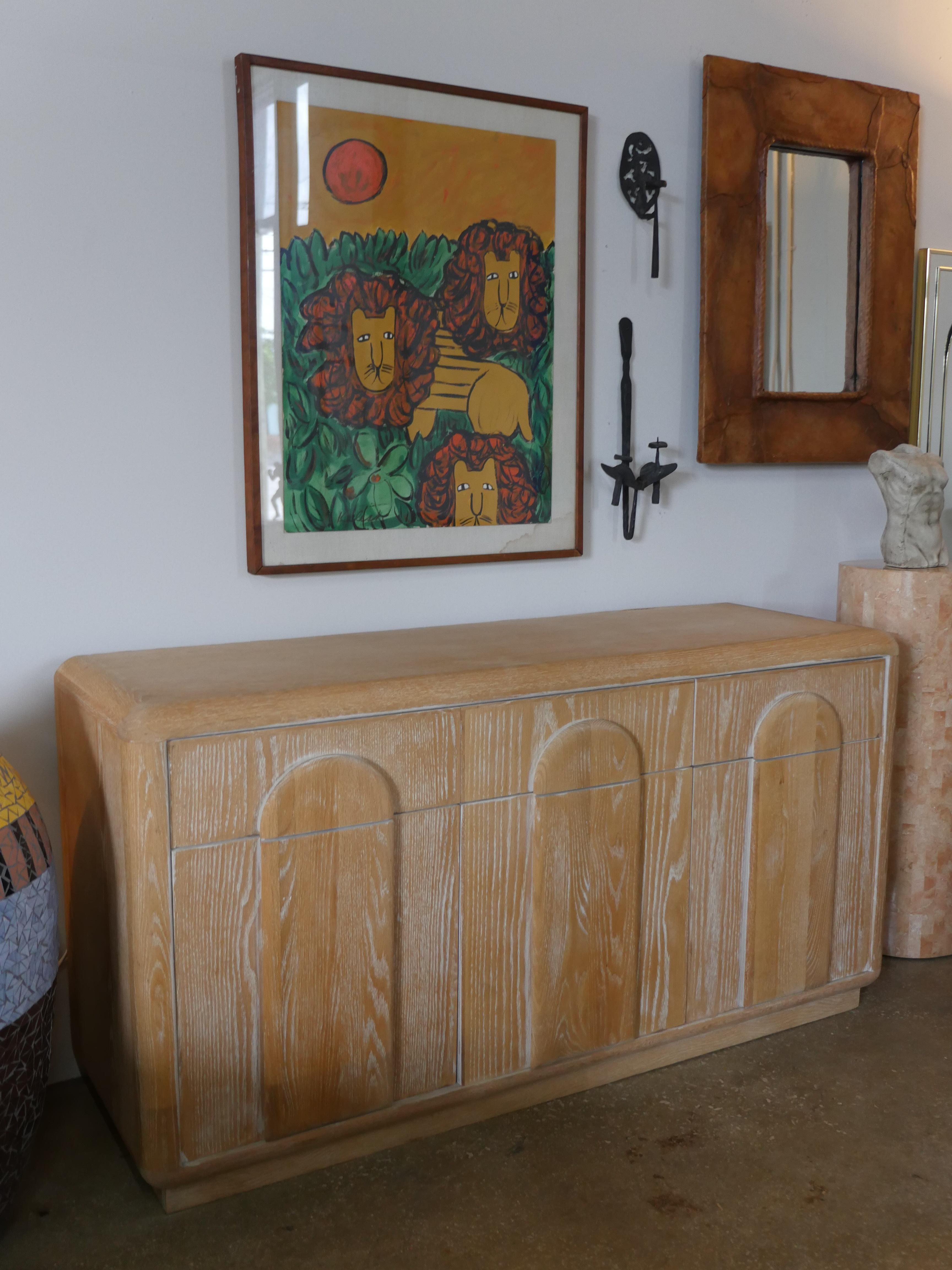 1980s cerused oak wood sideboard with arched detailed doors. The original owners had the oak wood bleached, giving it a beautiful coastal look that fits well in any space.
