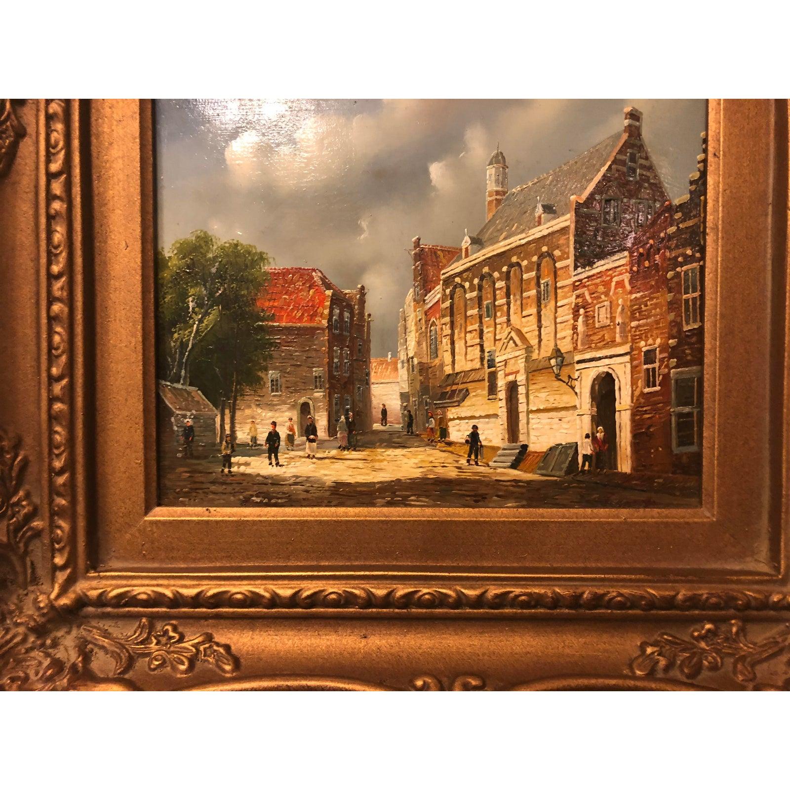 1980s oil on panel gilt framed genre painting
This is a framed oil on panel genre painting. The piece was made in the 1980s. The frame is beautifully hand carved in an antiqued gilt fashion. The scene depicts a normal day in a small village.