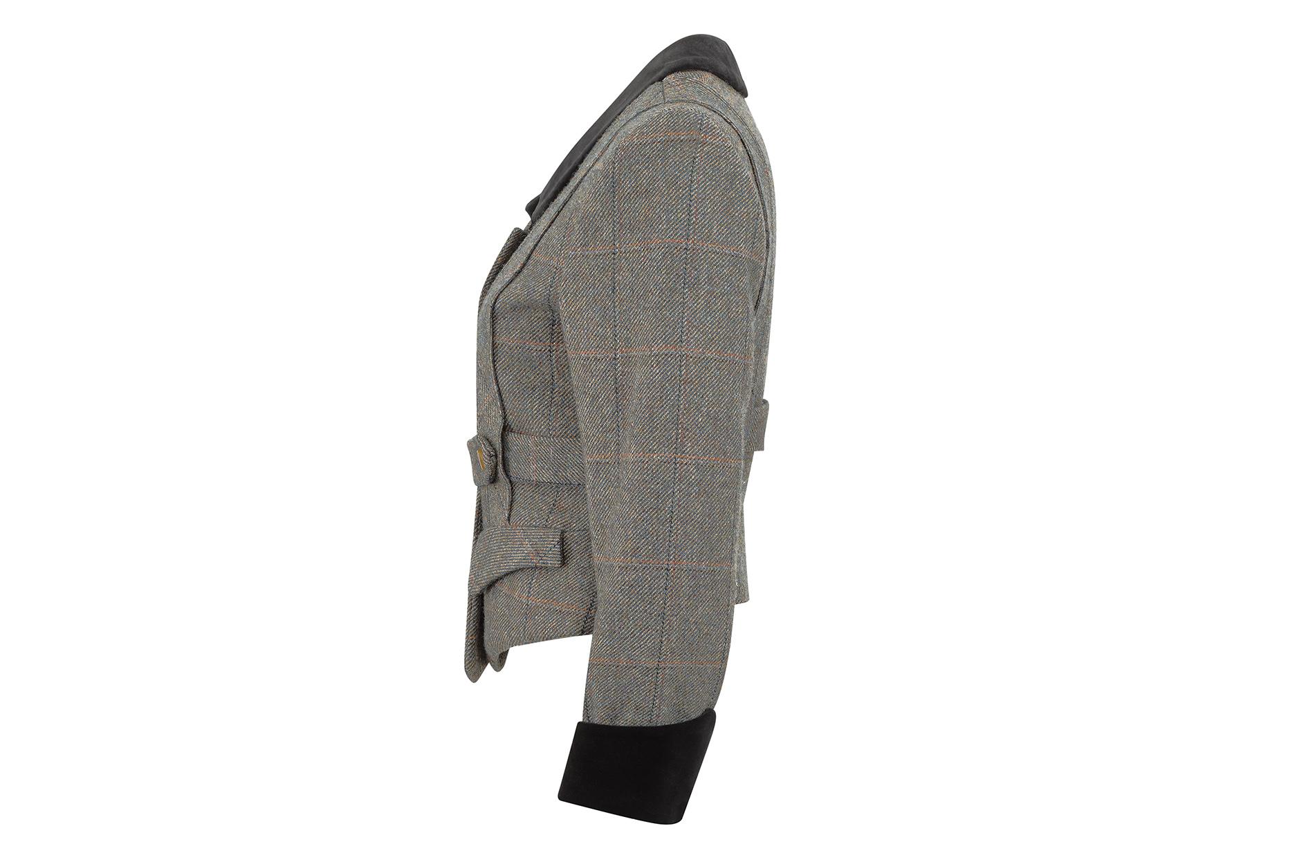 This desirable 1980s Harris tweed jacket with velvet trim is unmistakably Vivienne Westwood, often extolled as the doyenne of British fashion for her controversial, eccentric, punk-inspired designs. The jacket is part of a skirt and hat ensemble