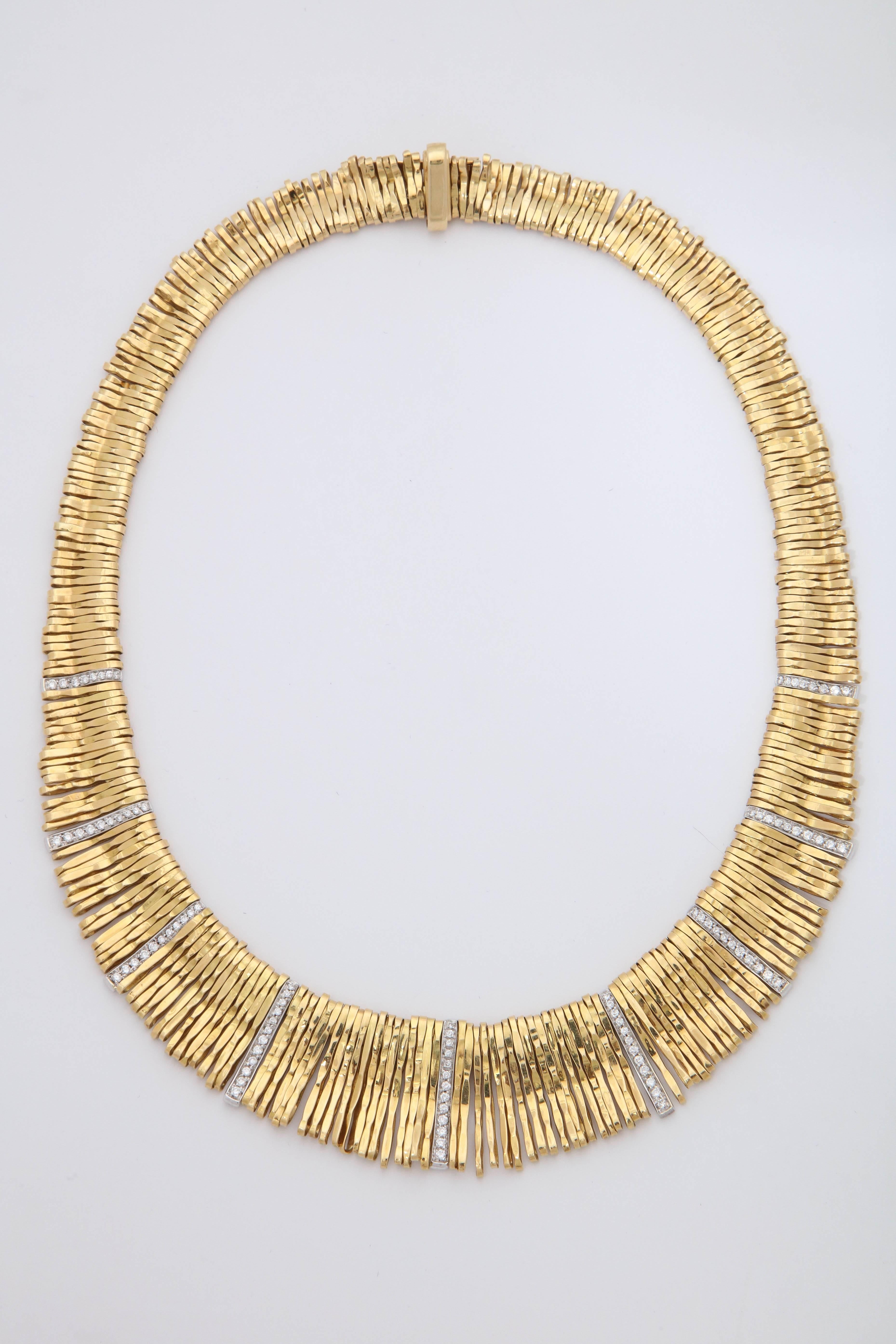 One Ladies 18kt Bright Yellow Gold Necklace Composed Of Multiple Handmade Gold Moveable And Flexible Open Loops. Necklace Is Further Designed With Numerous Full cut Diamonds Weighing Approximately 2 Carats Total Weight Signed Orlandini Stamped 750