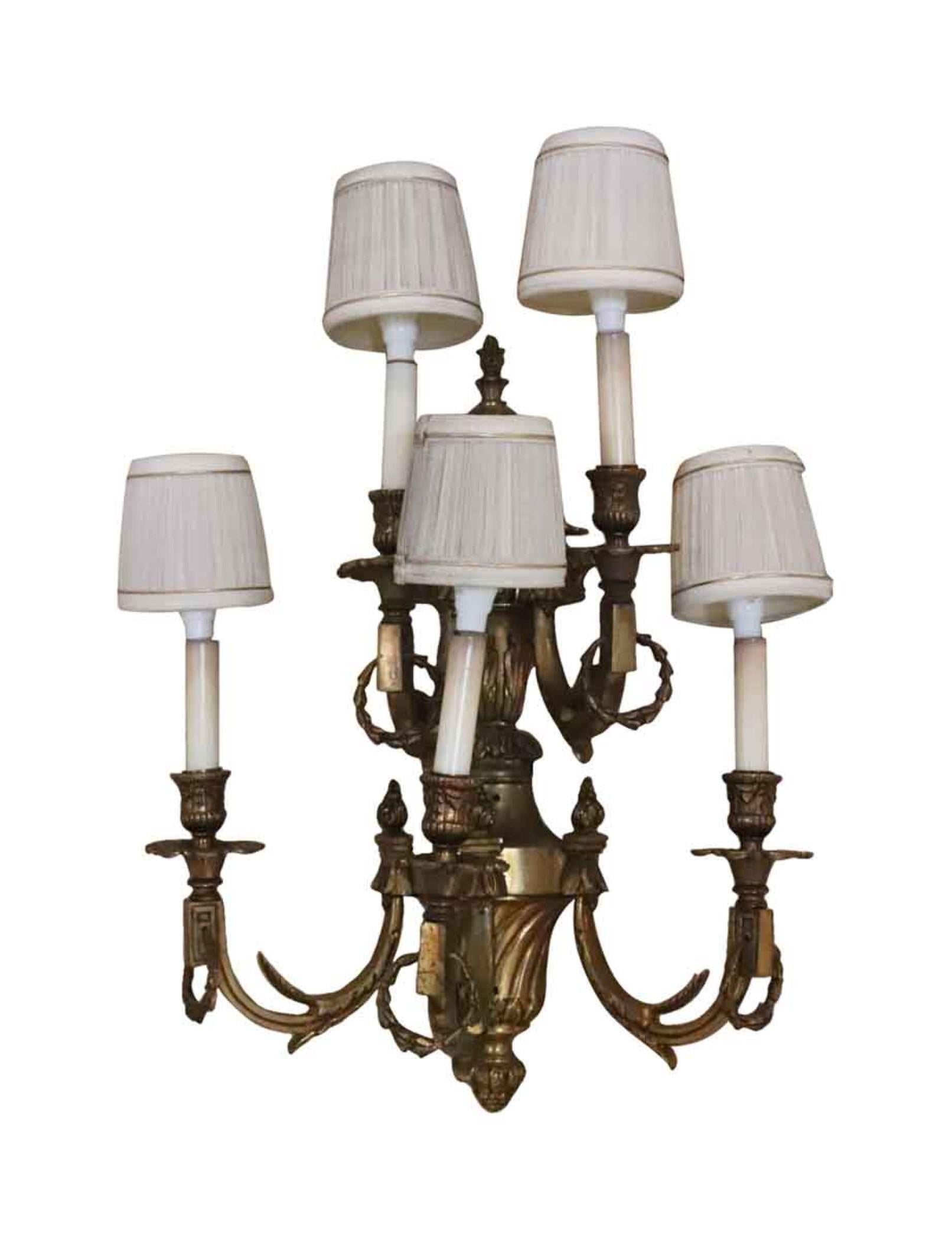Heavy cast decorative bronze five light sconces with shades from The Conrad Suite side room in the Waldorf Astoria. These are vintage 1980s. Price includes restoration. Waldorf Astoria authenticity card included with your purchase. Cleaned and